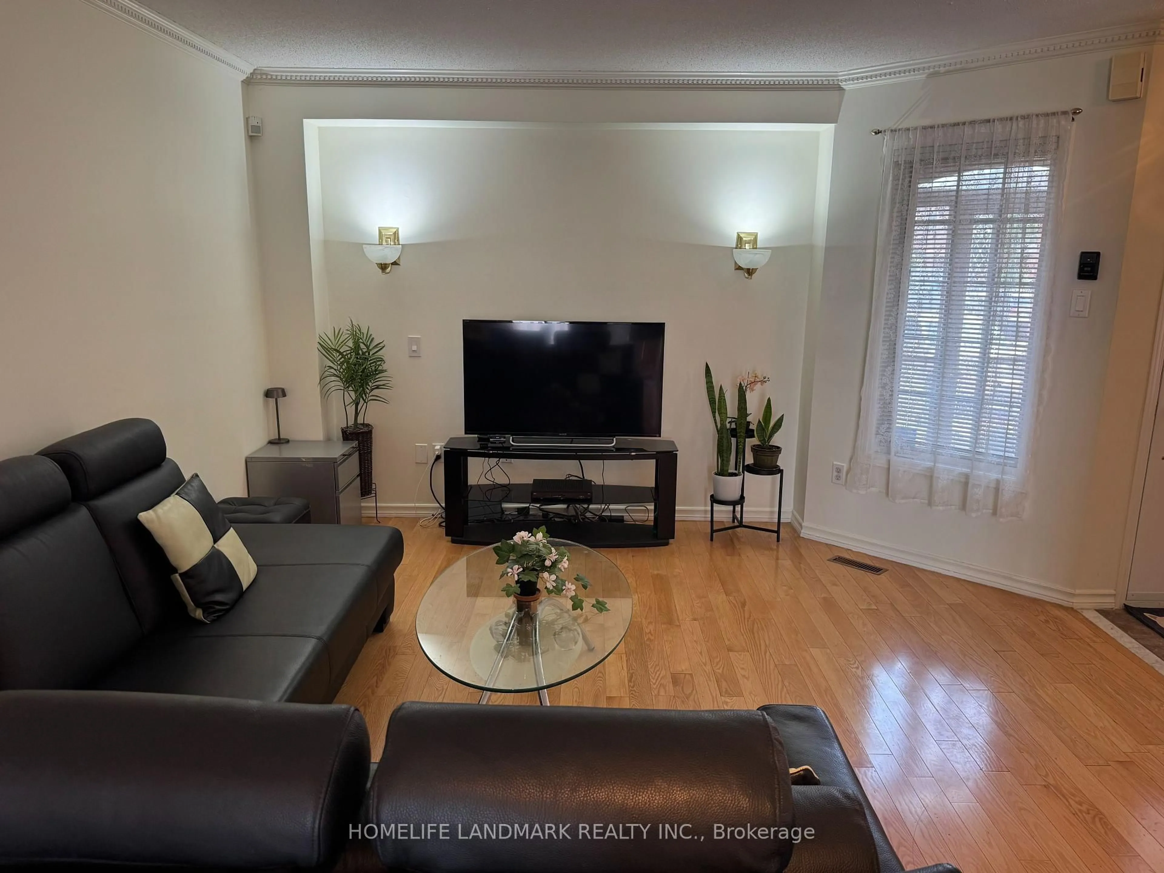Living room with furniture, wood/laminate floor for 107 KRUGER Rd, Markham Ontario L3S 3Y7