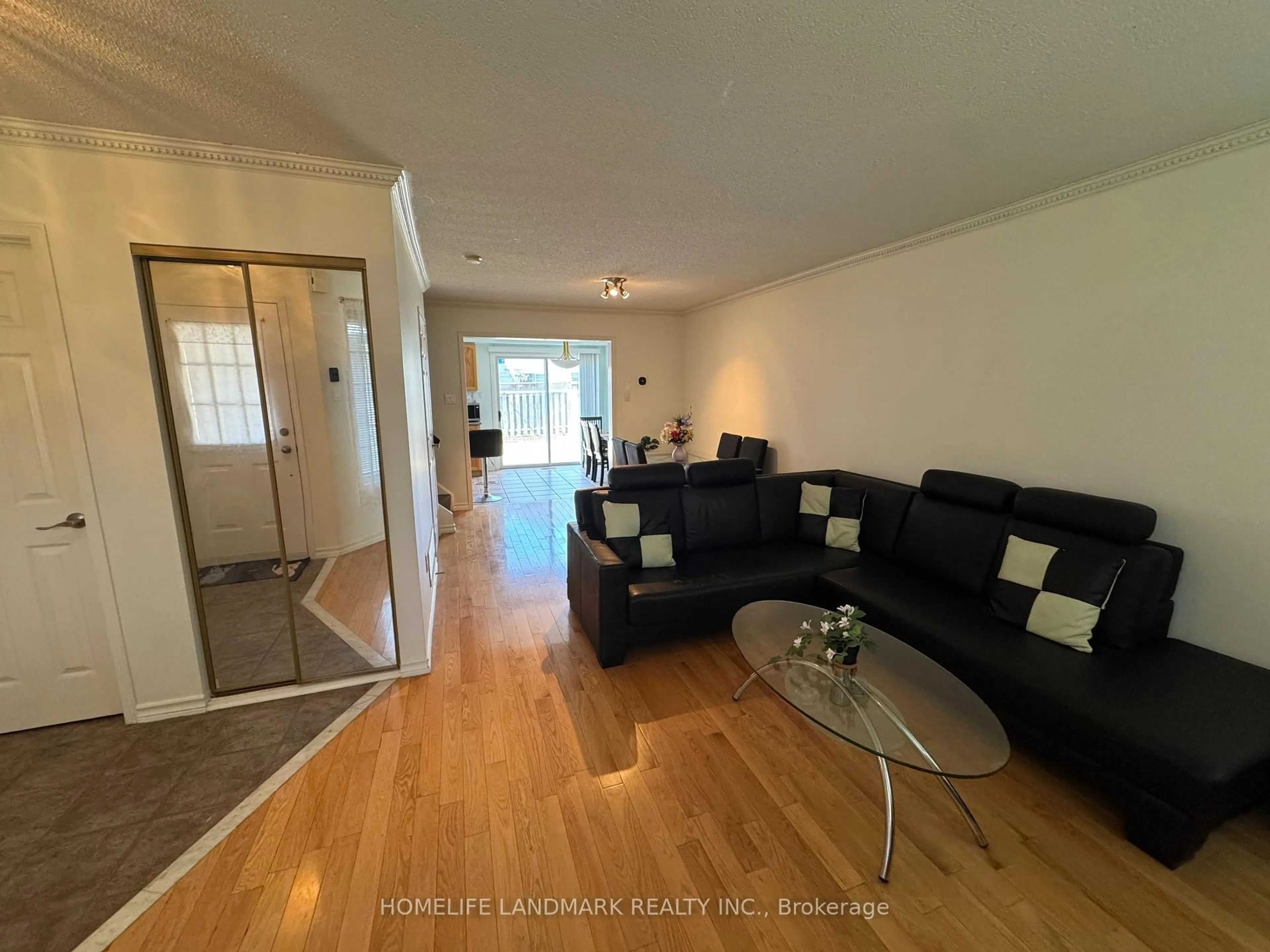 Living room with furniture, wood/laminate floor for 107 KRUGER Rd, Markham Ontario L3S 3Y7