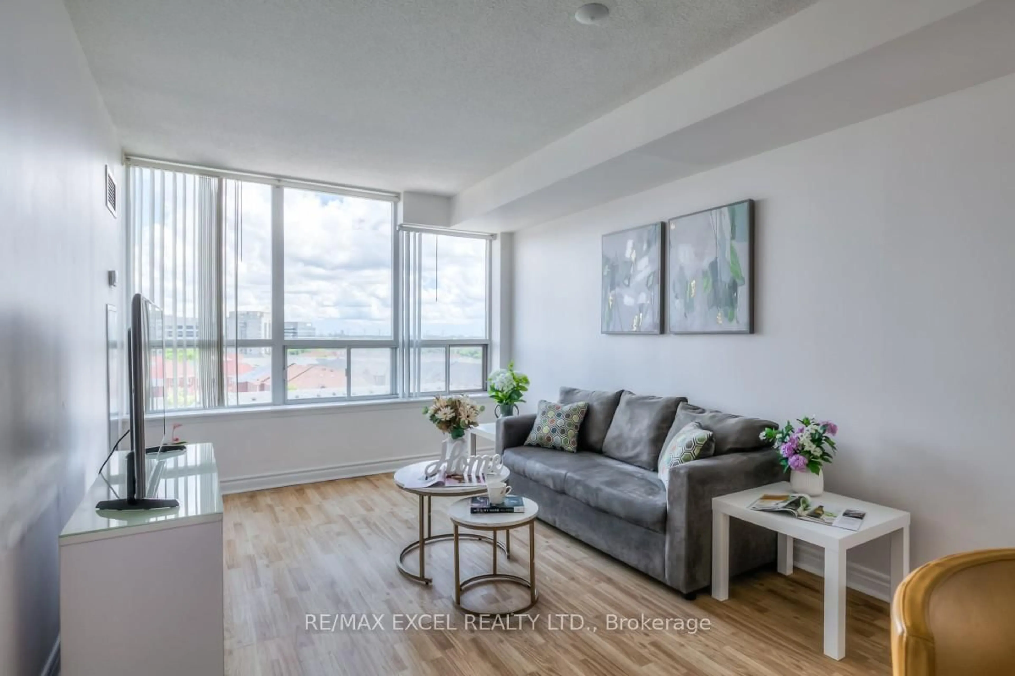 Living room with furniture, wood/laminate floor for 25 Times Ave #701, Markham Ontario L3T 7X5