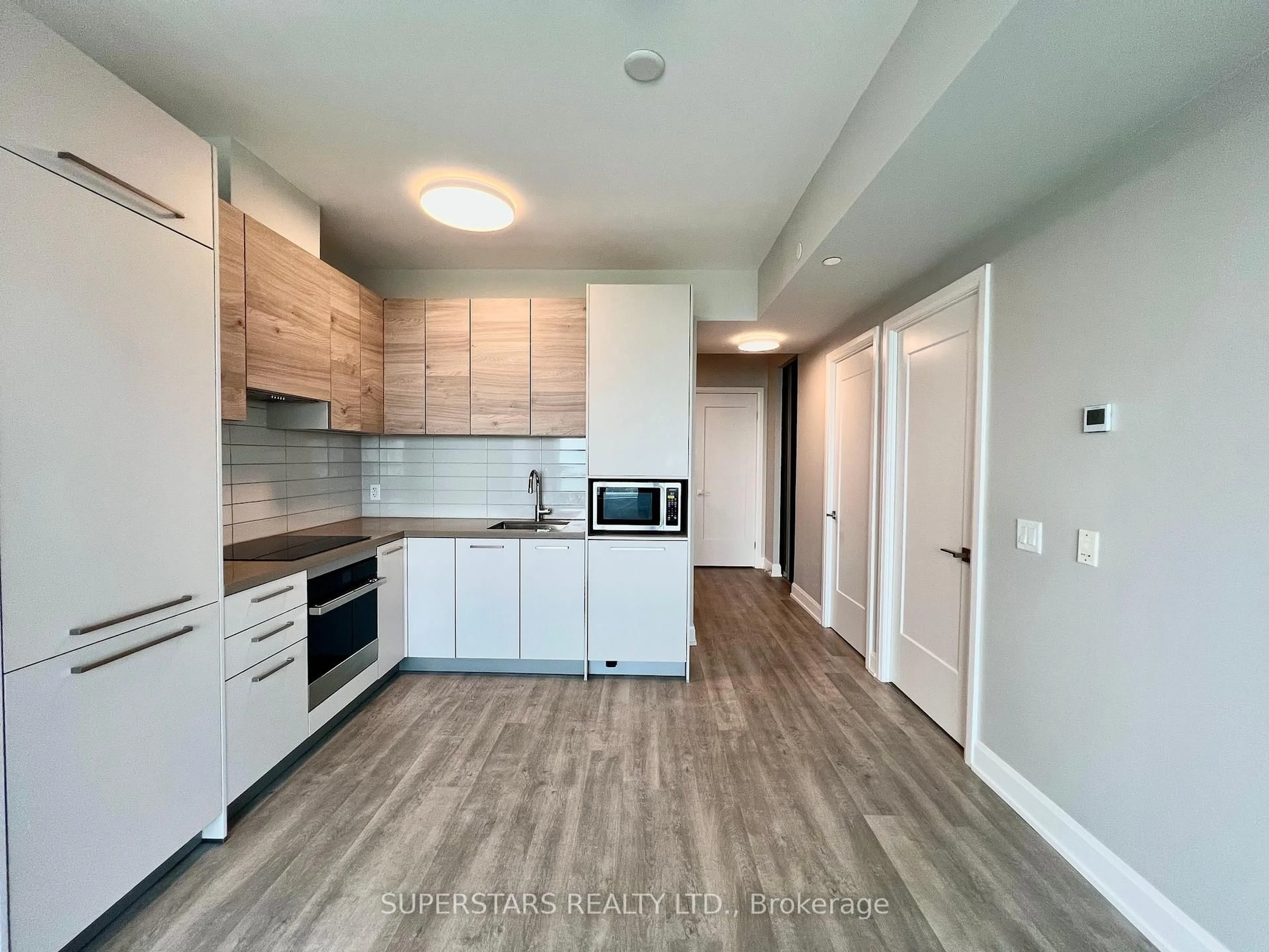 Open concept kitchen, wood/laminate floor for 12 Gandhi Lane #3008, Markham Ontario L3T 0G8