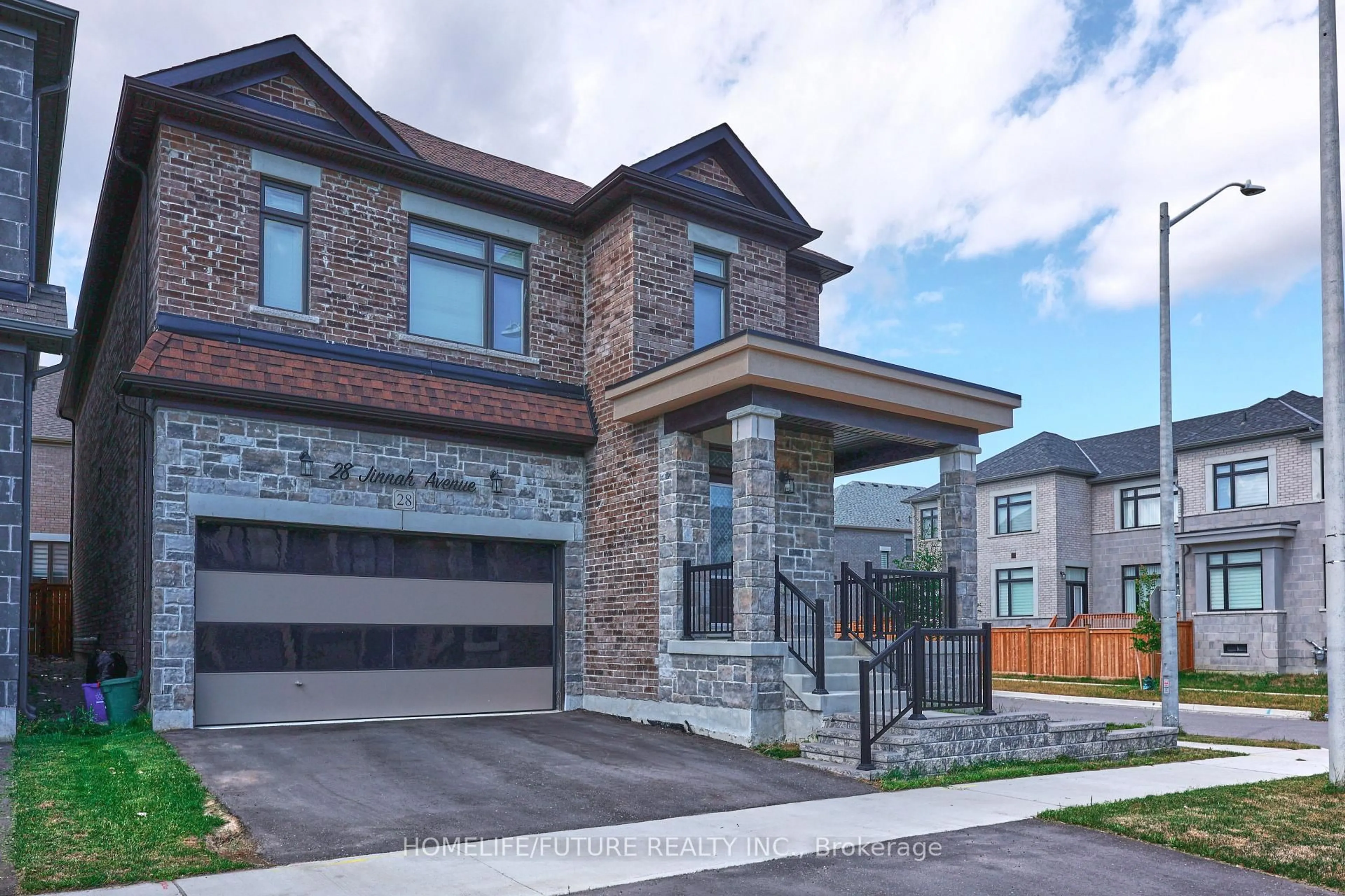 Home with brick exterior material, street for 28 Jinnah Ave, Markham Ontario L3S 0G2