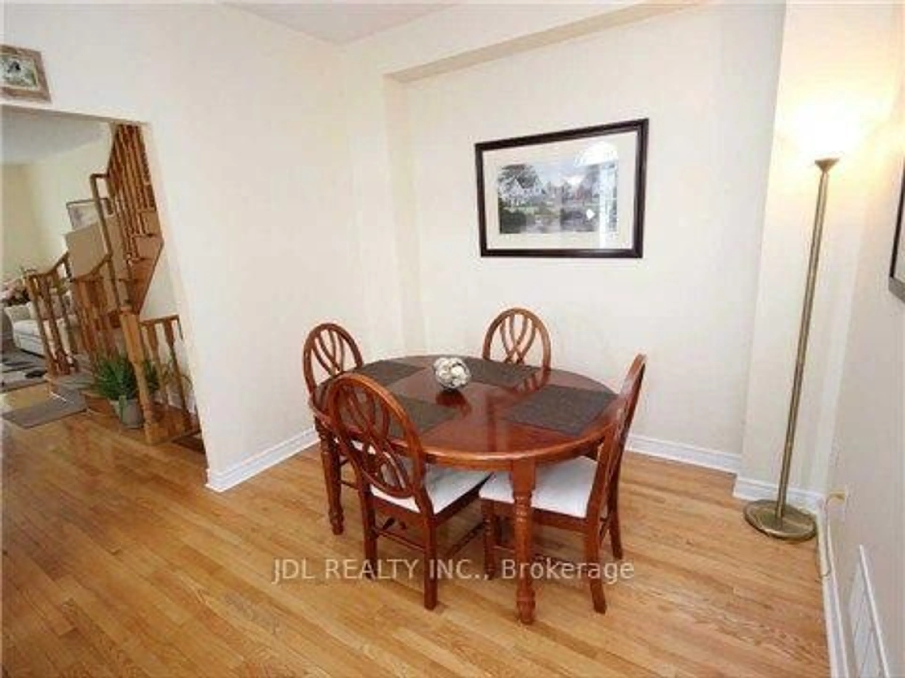 Dining room, wood/laminate floor for 1919 Bur Oak Ave, Markham Ontario L6E 1W3