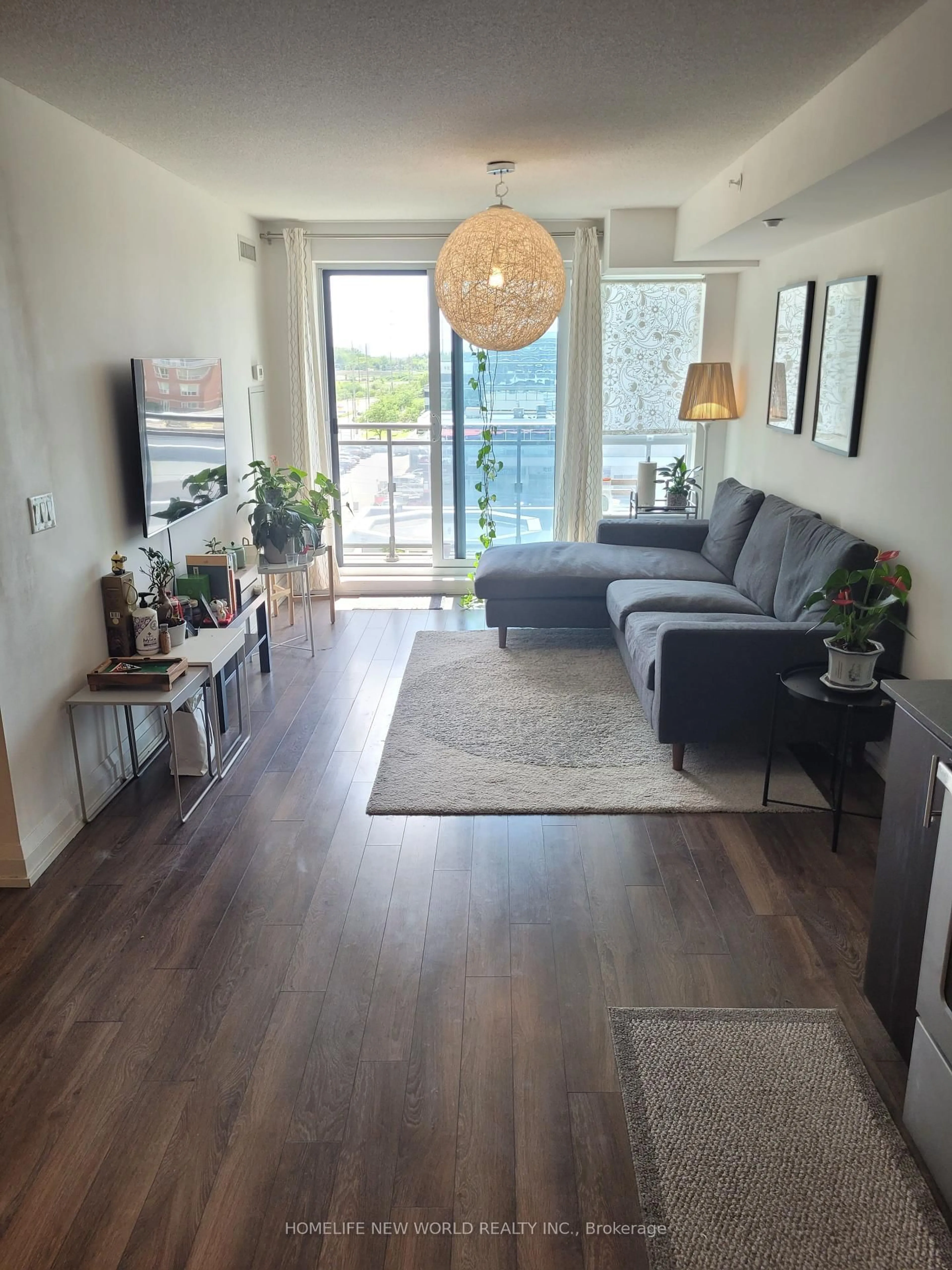Living room with furniture, wood/laminate floor for 370 Highway 7 Rd #717, Richmond Hill Ontario L4B 0C4