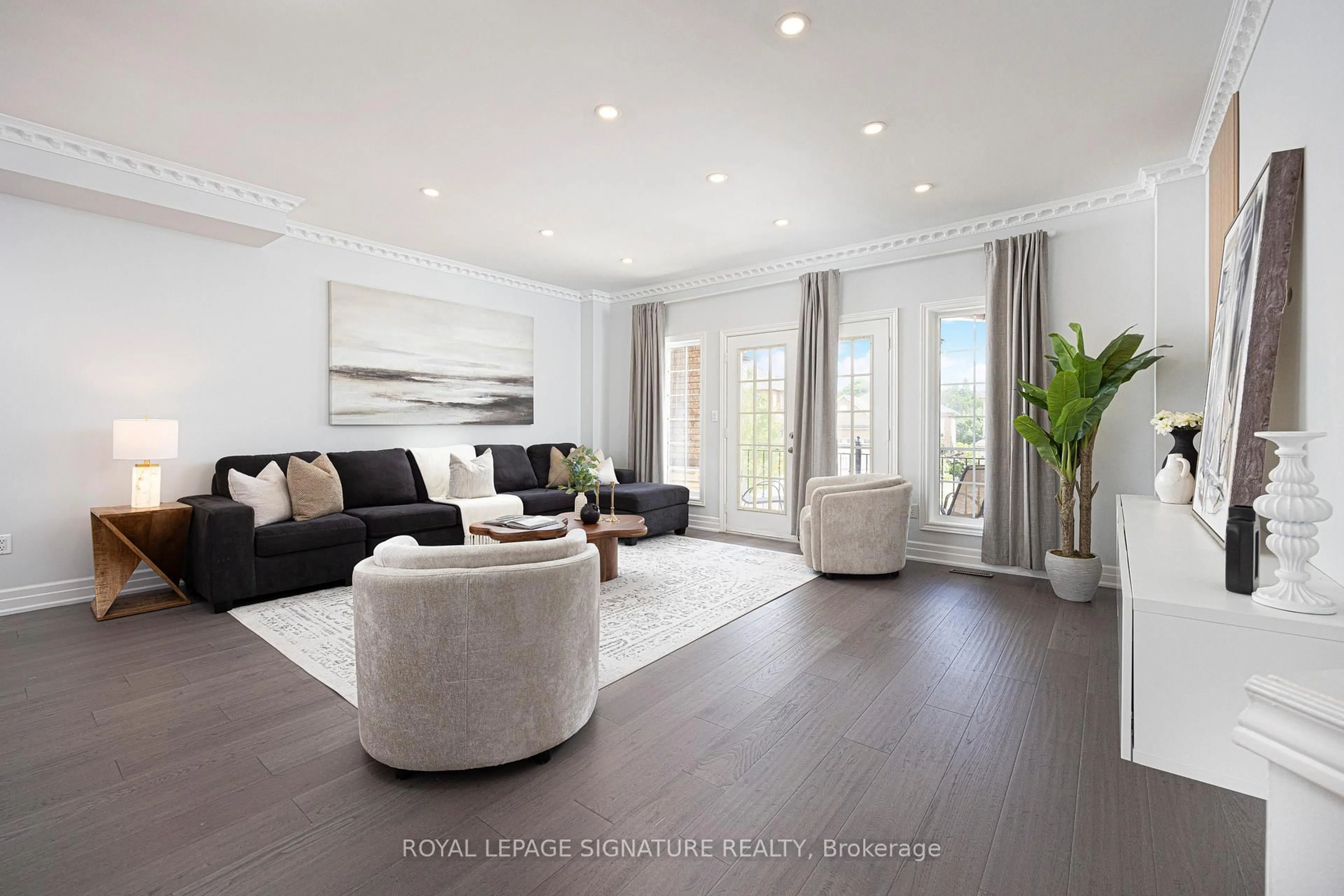 Living room with furniture, wood/laminate floor for 559 Royalpark Way, Vaughan Ontario L4H 1K4