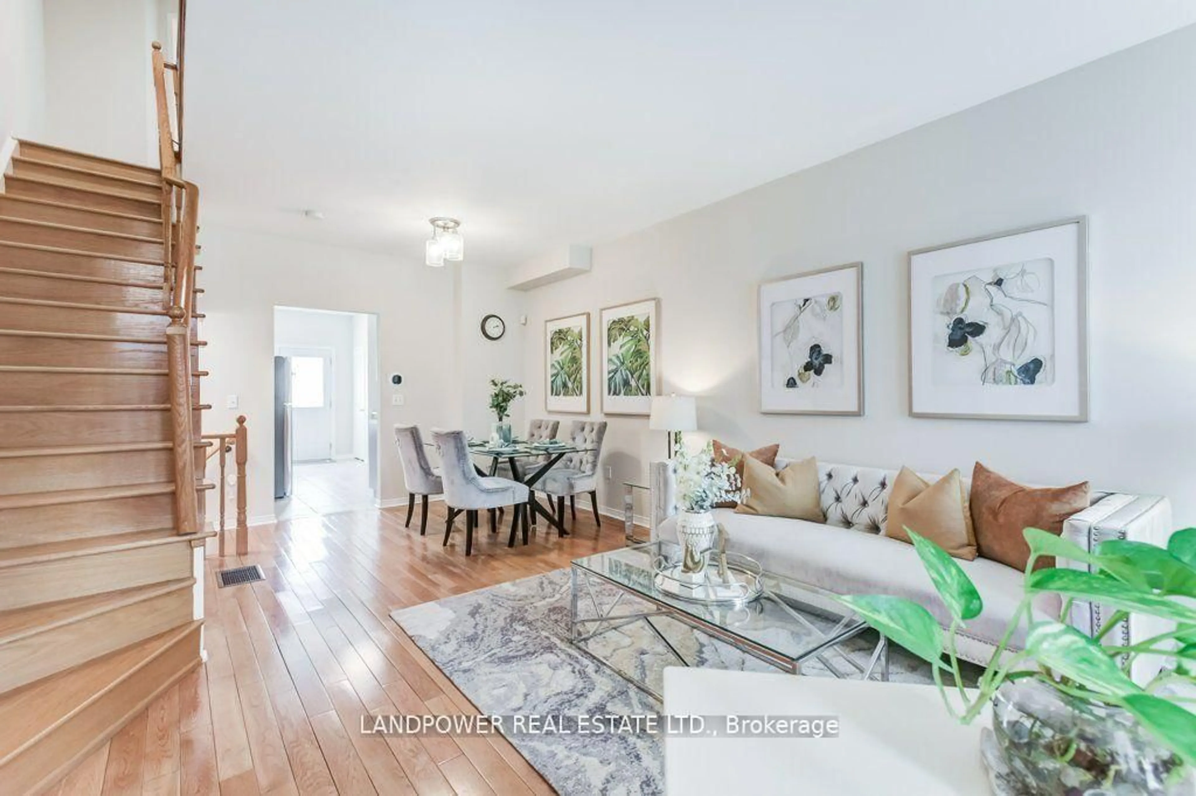 Living room with furniture, wood/laminate floor for 165 Bur Oak Ave, Markham Ontario L6C 2G1