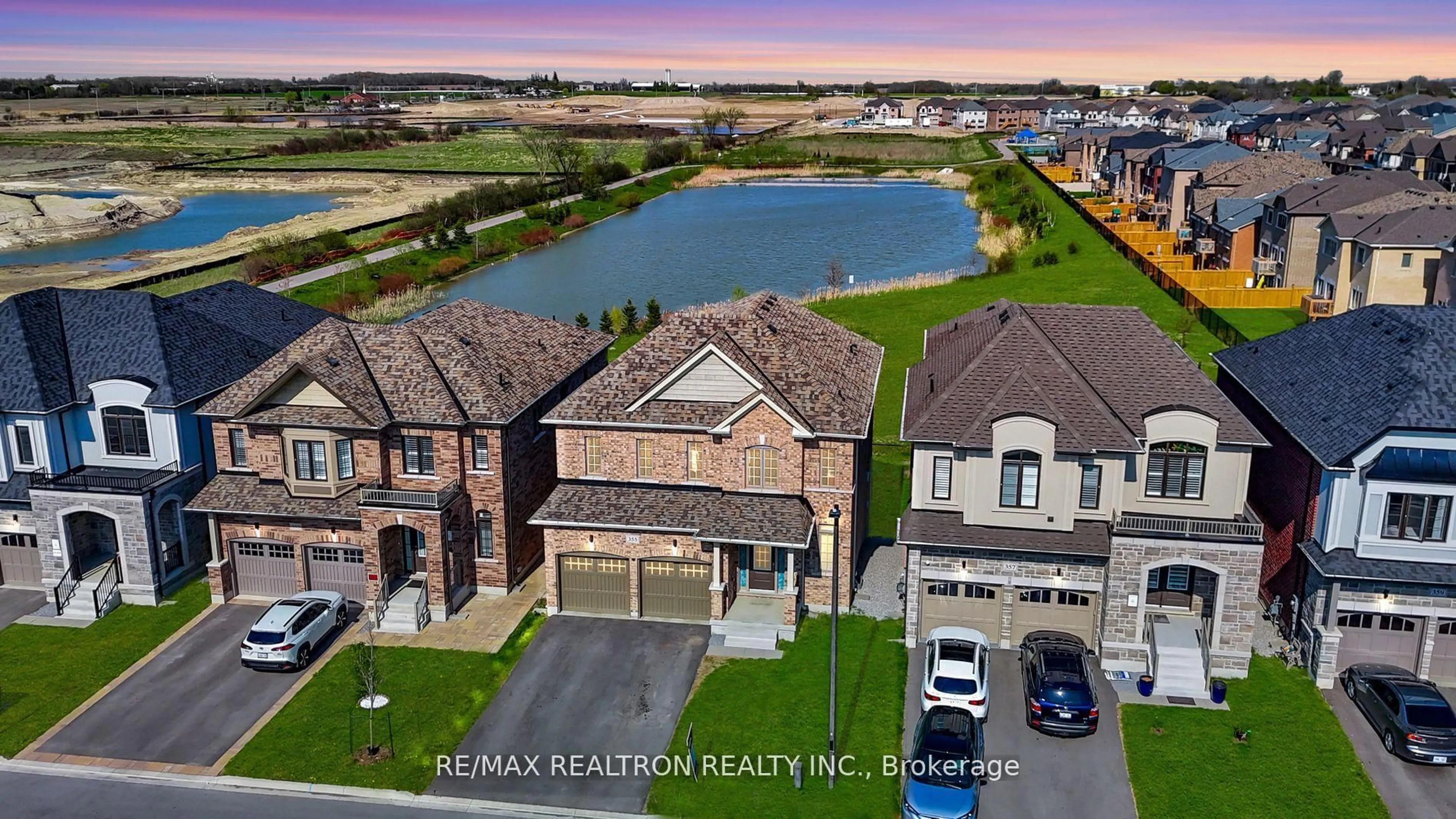 A pic from outside/outdoor area/front of a property/back of a property/a pic from drone, water/lake/river/ocean view for 355 Danny Wheeler Blvd, Georgina Ontario L4P 3C8