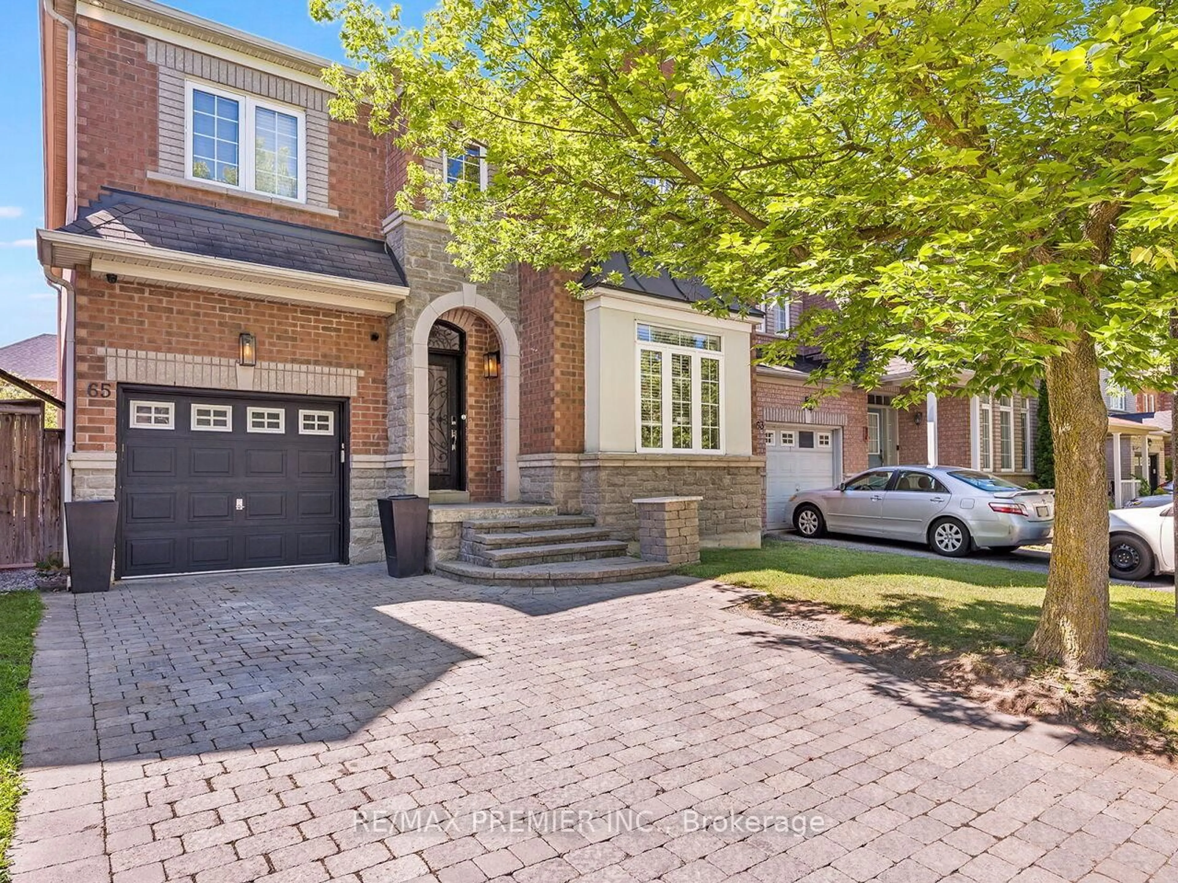 Home with brick exterior material, street for 65 Victoria Wood Ave, Markham Ontario L6E 1K2