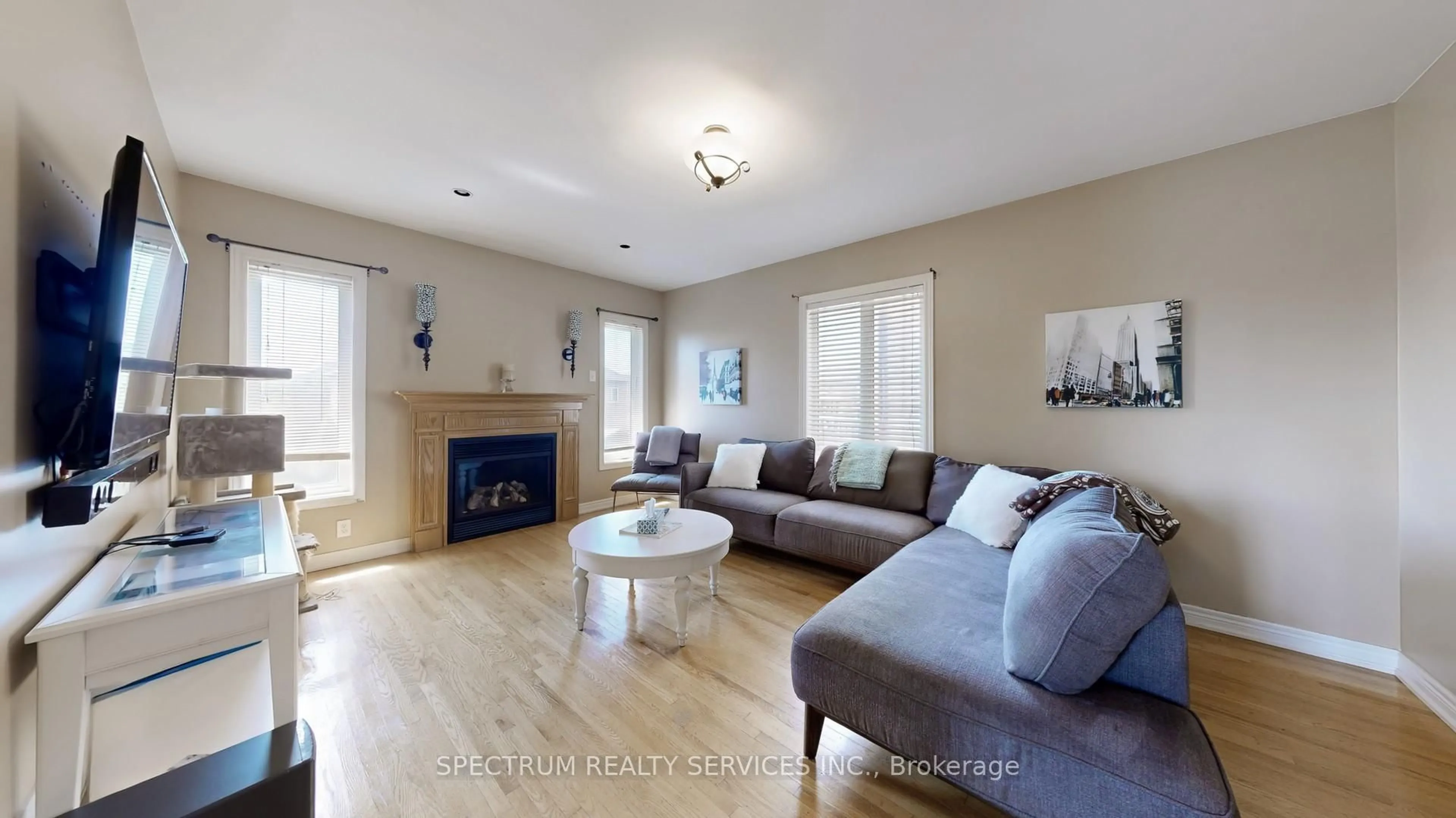 Living room with furniture, wood/laminate floor for 24 Cachet Hill Cres, Vaughan Ontario L4H 1S6