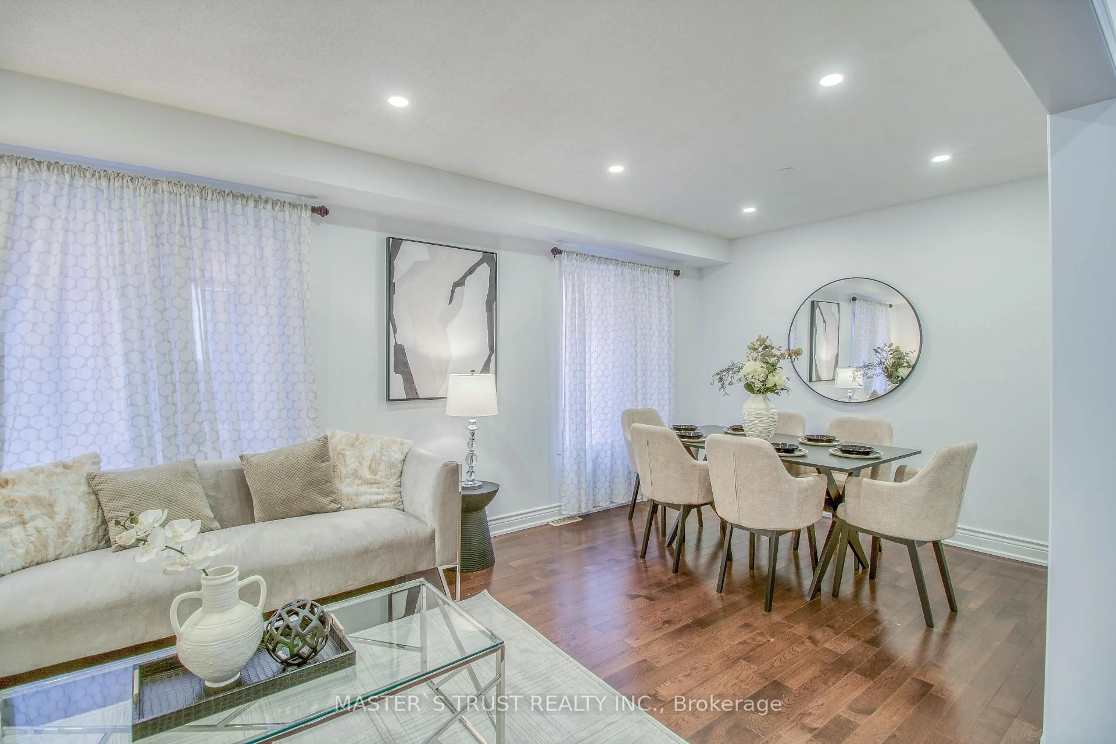 Living room with furniture, wood/laminate floor for 8 Charles Brown Rd, Markham Ontario L3S 4T3