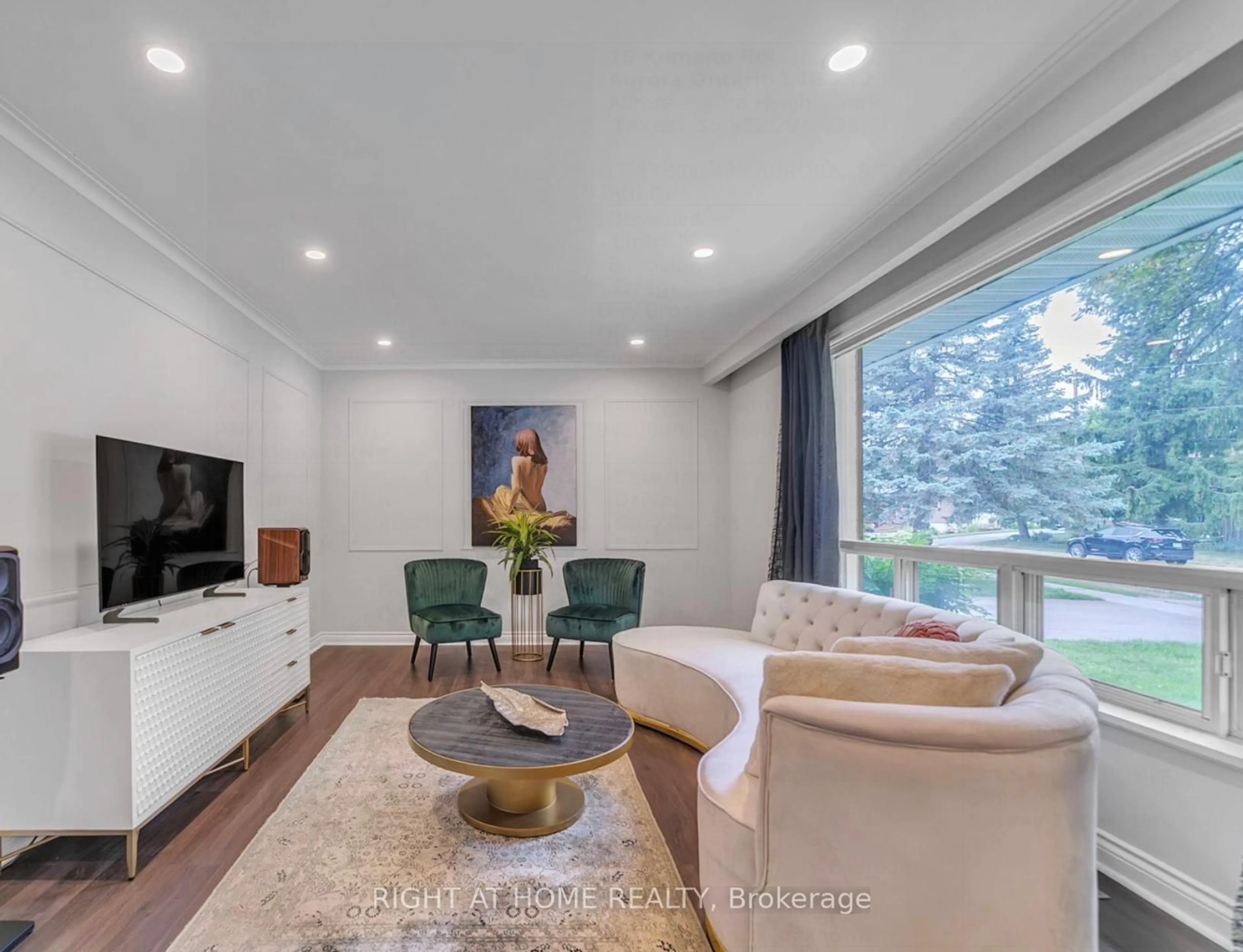 Living room with furniture, wood/laminate floor for 15 Kemano Rd, Aurora Ontario L4G 2Y2