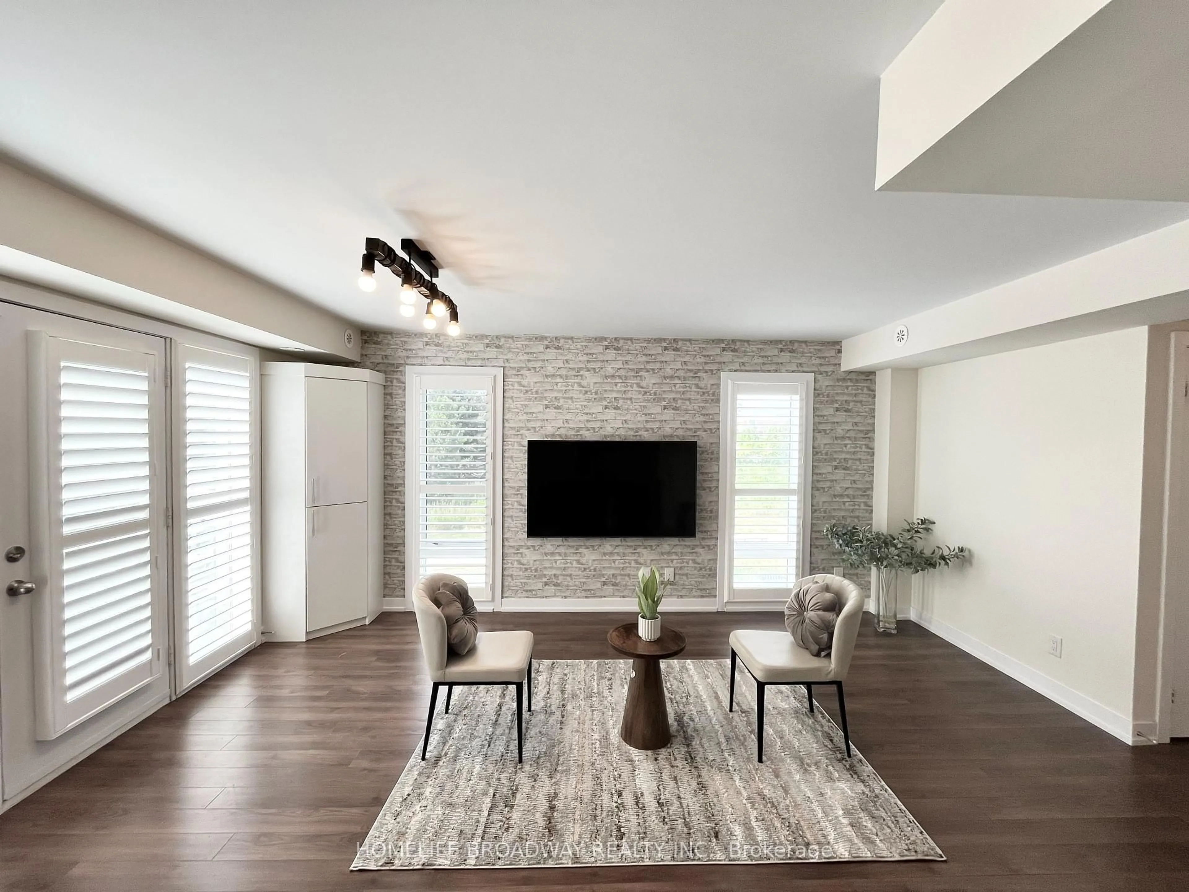 Living room with furniture, wood/laminate floor for 2 Dunsheath Way #131, Markham Ontario L6B 1N3