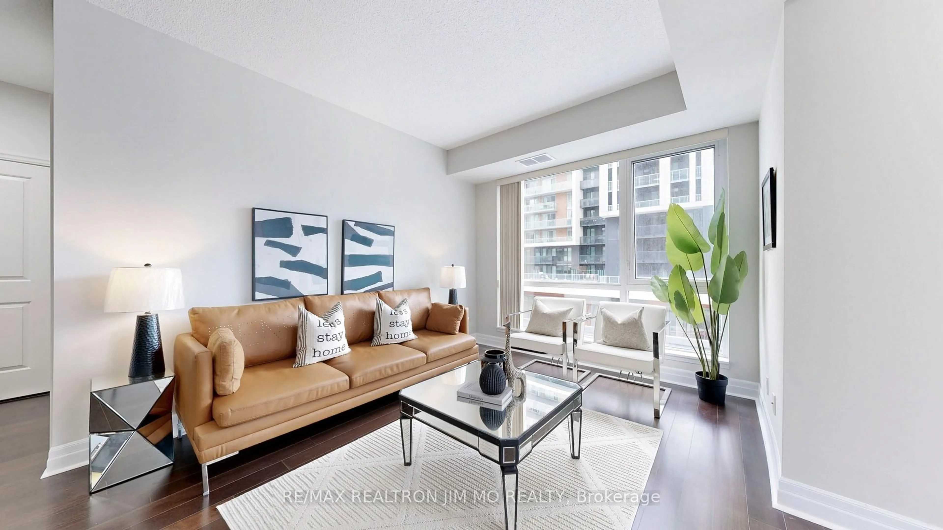 Living room with furniture, wood/laminate floor for 8110 Birchmount Rd #416, Markham Ontario L6G 0E3