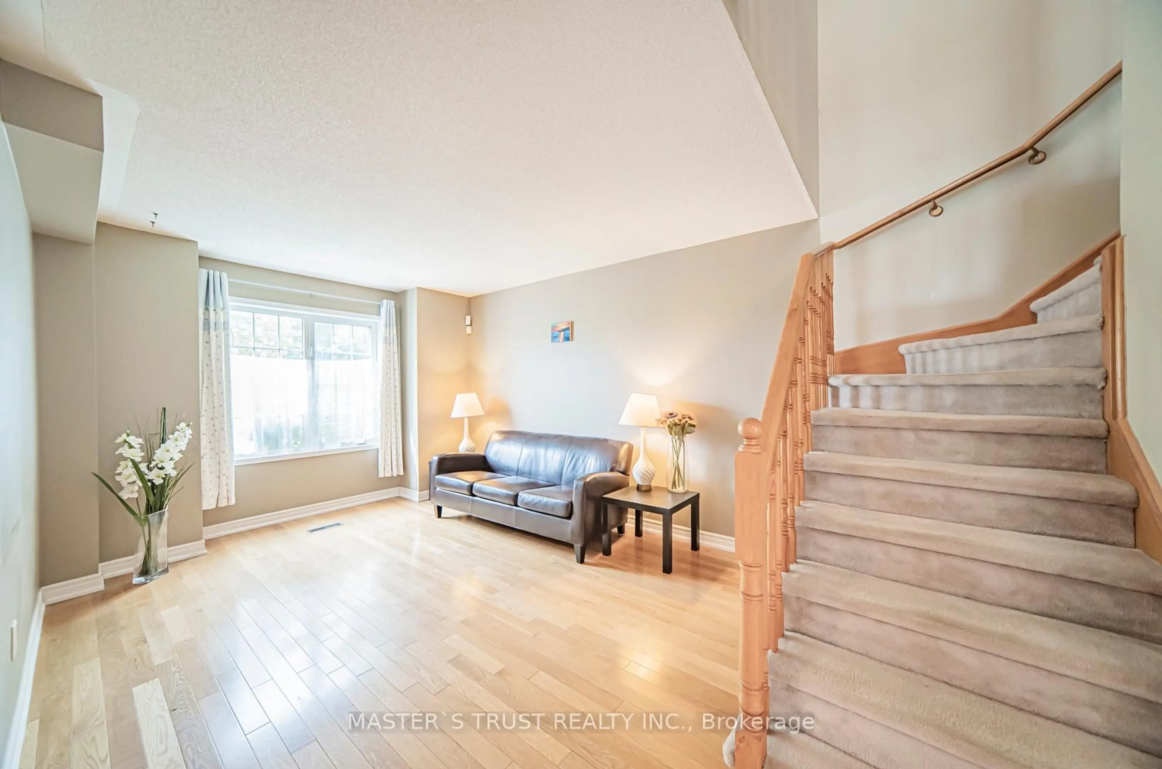 Living room with furniture, wood/laminate floor for 124 White's Hill Ave, Markham Ontario L6B 1C8