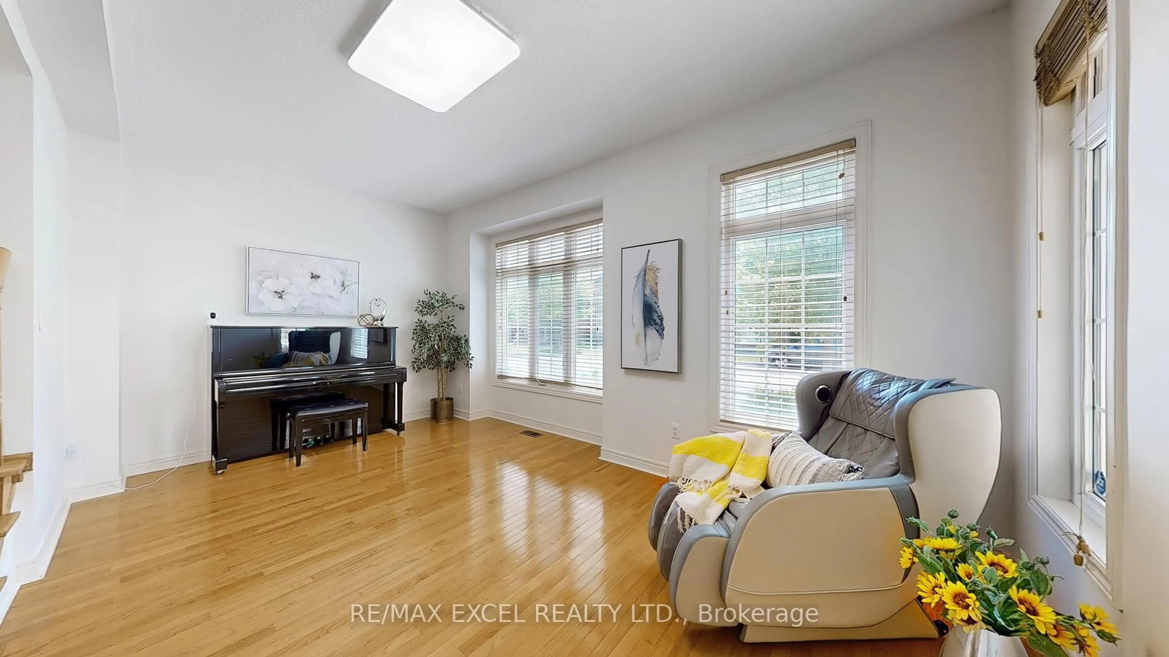 Living room with furniture, wood/laminate floor for 809 Cornell Rouge Blvd, Markham Ontario L6B 0K5