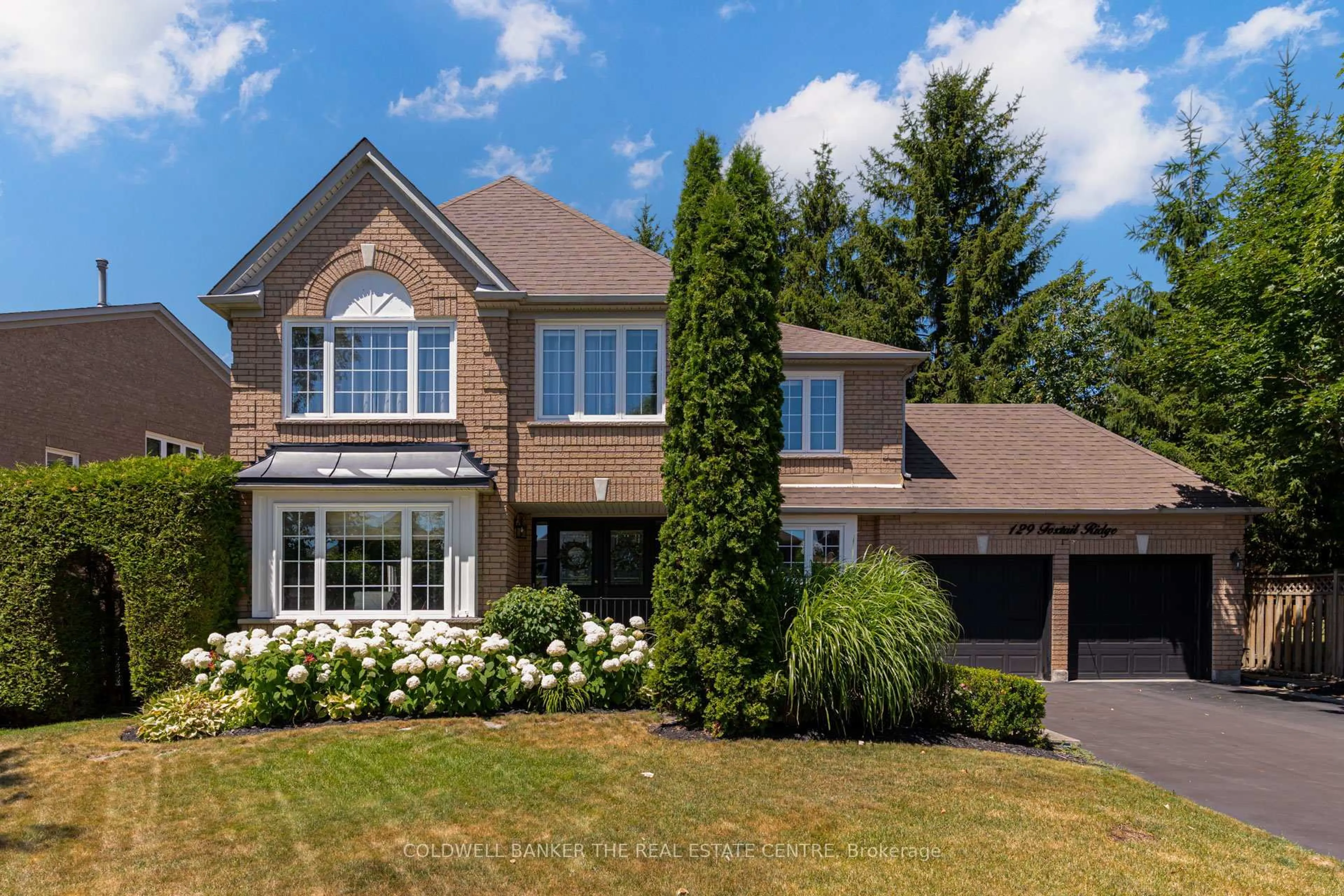 Home with brick exterior material, street for 129 Foxtail Rdge, Newmarket Ontario L3X 1Z2