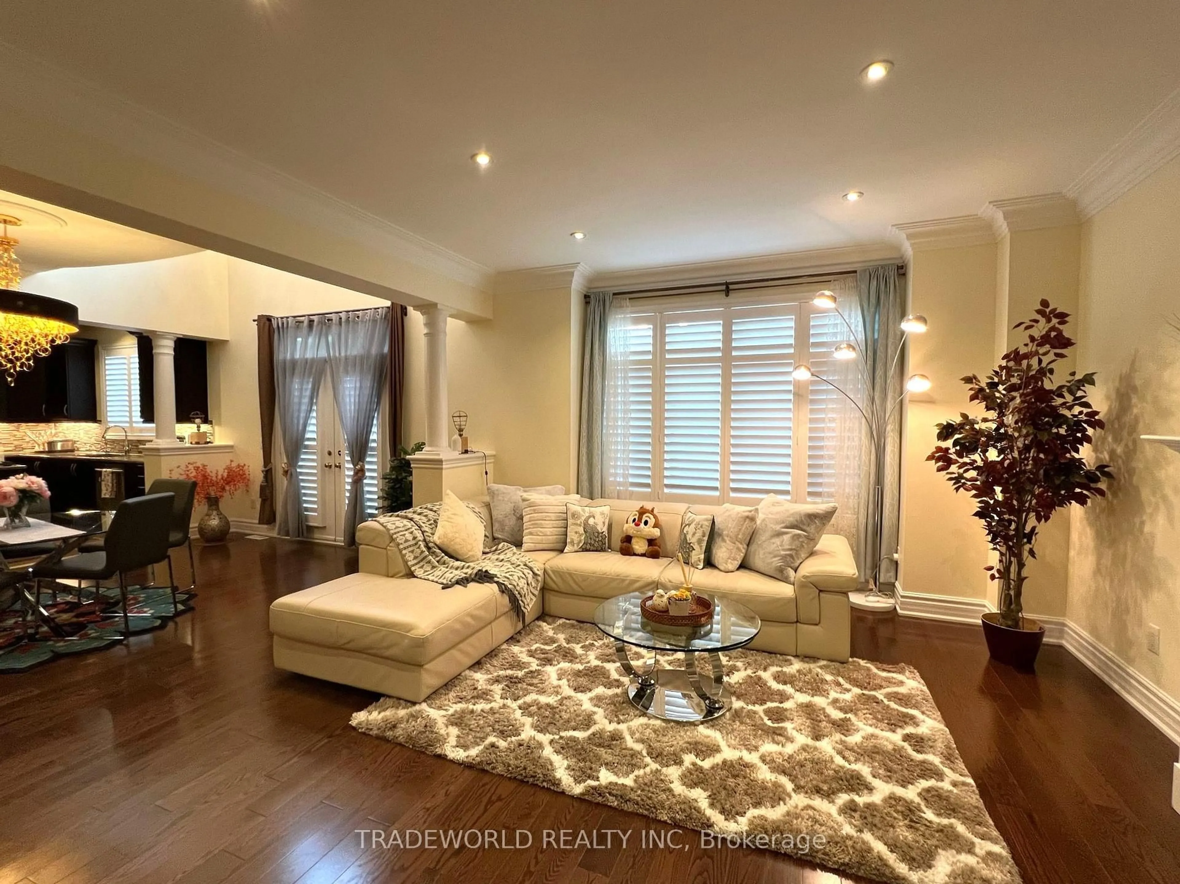 Living room with furniture, wood/laminate floor for 73 Glengordon Cres, Markham Ontario L6C 0K1