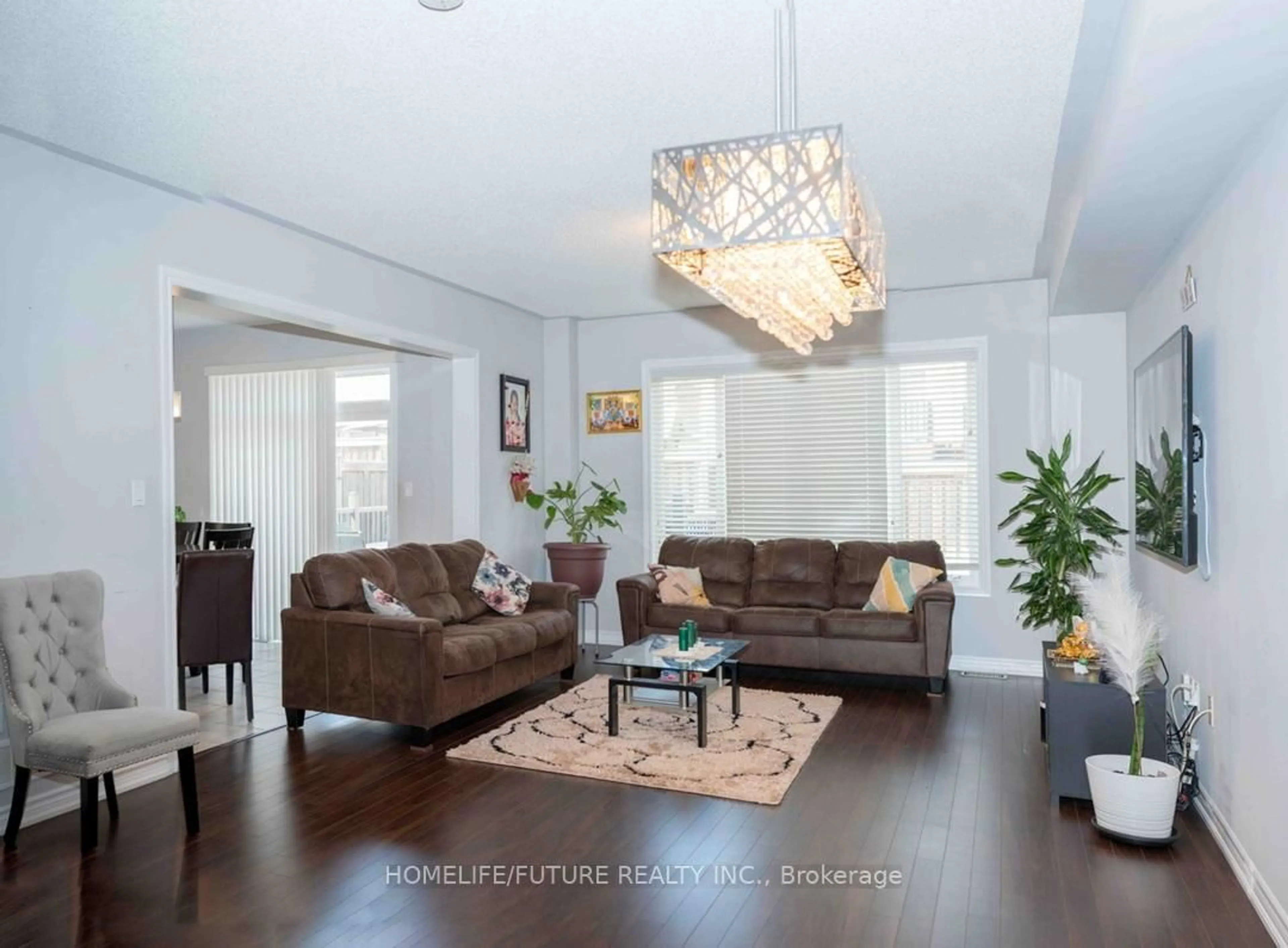 Living room with furniture, wood/laminate floor for 72 Hopkins Cres, Bradford West Gwillimbury Ontario L3Z 0R7