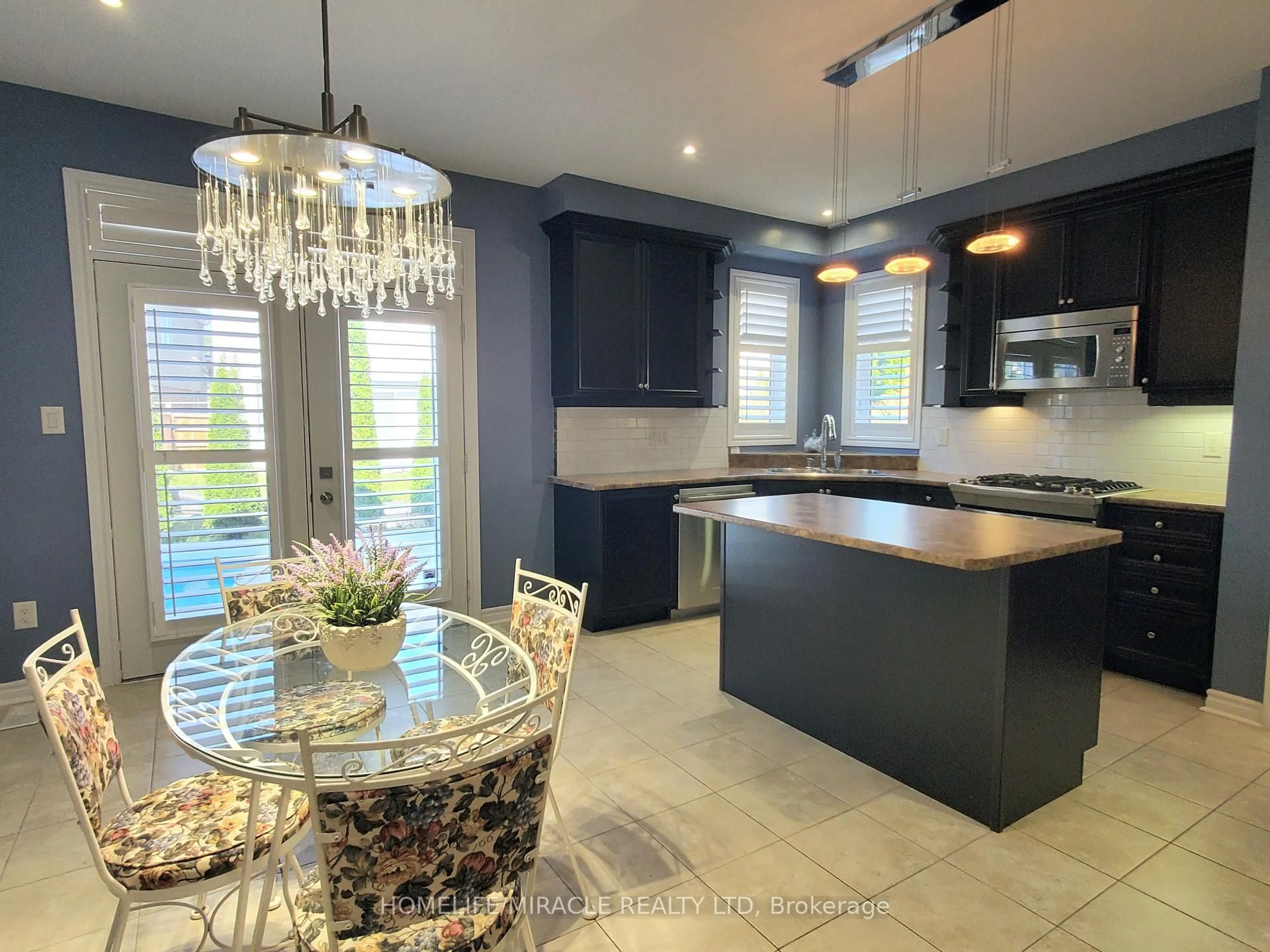 Open concept kitchen, ceramic/tile floor for 15 Lion's Crt, Essa Ontario L0M 1B5