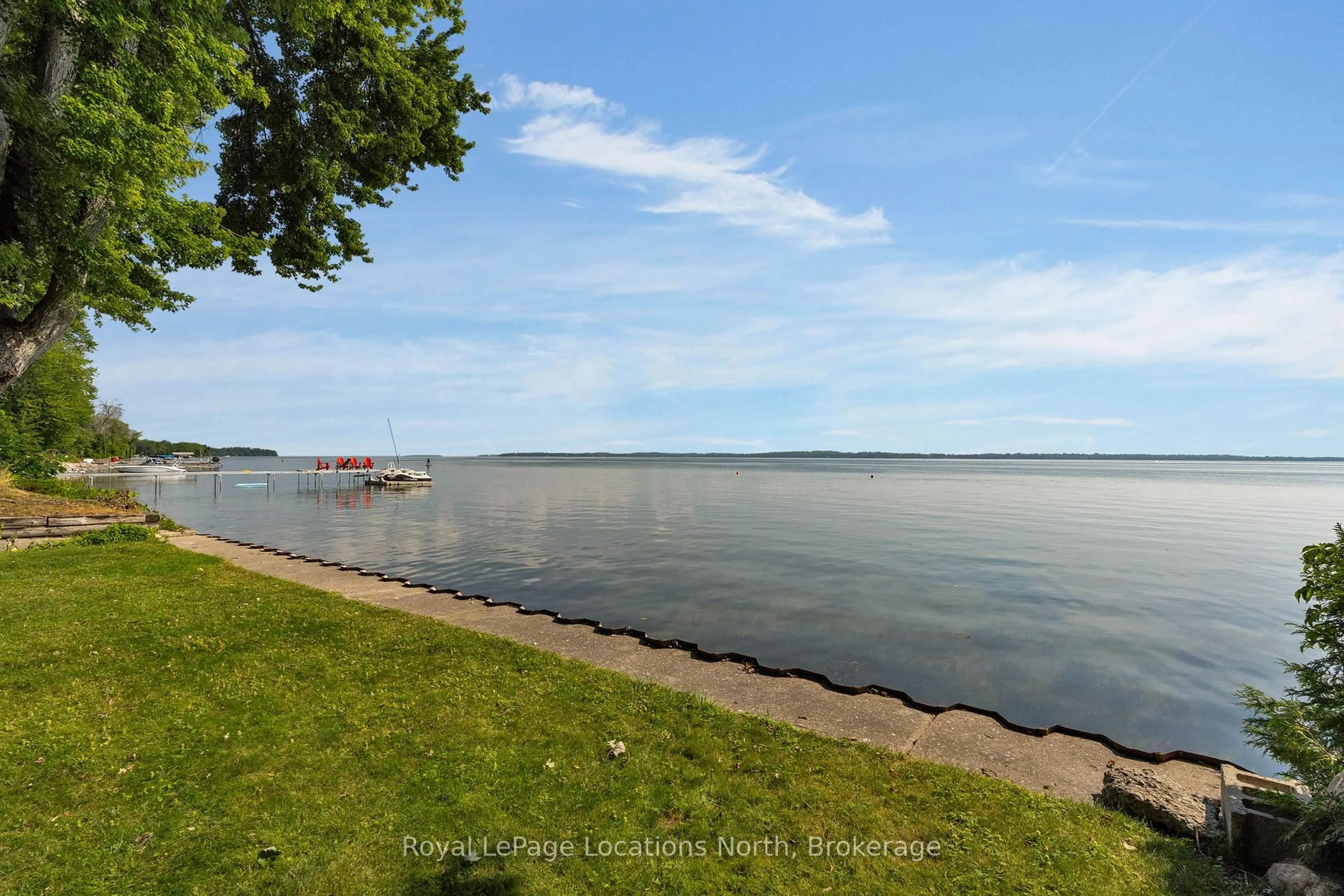 A pic from outside/outdoor area/front of a property/back of a property/a pic from drone, water/lake/river/ocean view for 297 Beach Rd, Innisfil Ontario L0L 1R0