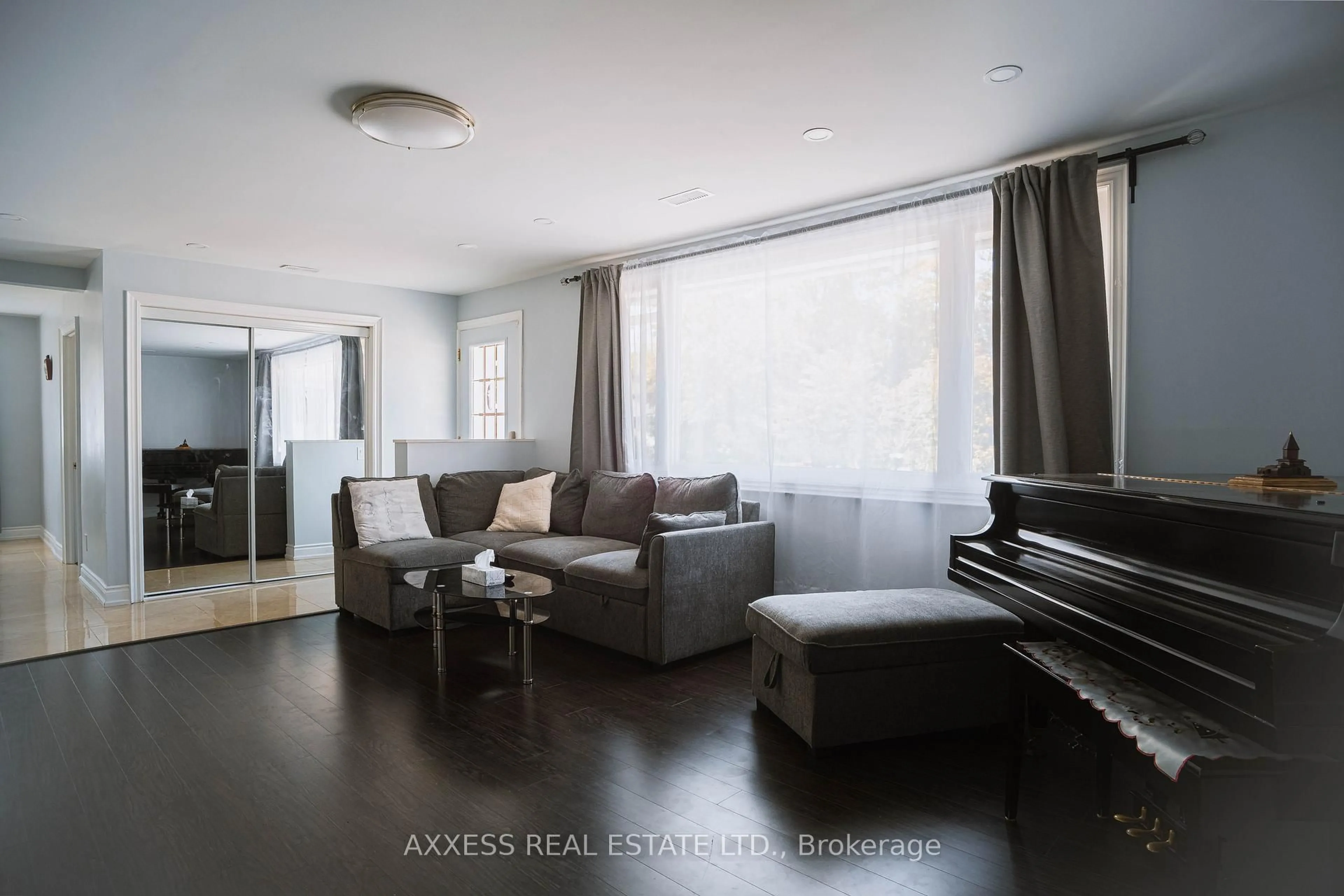 Living room with furniture, wood/laminate floor for 263 Elm Ave, Georgina Ontario L4P 2V4