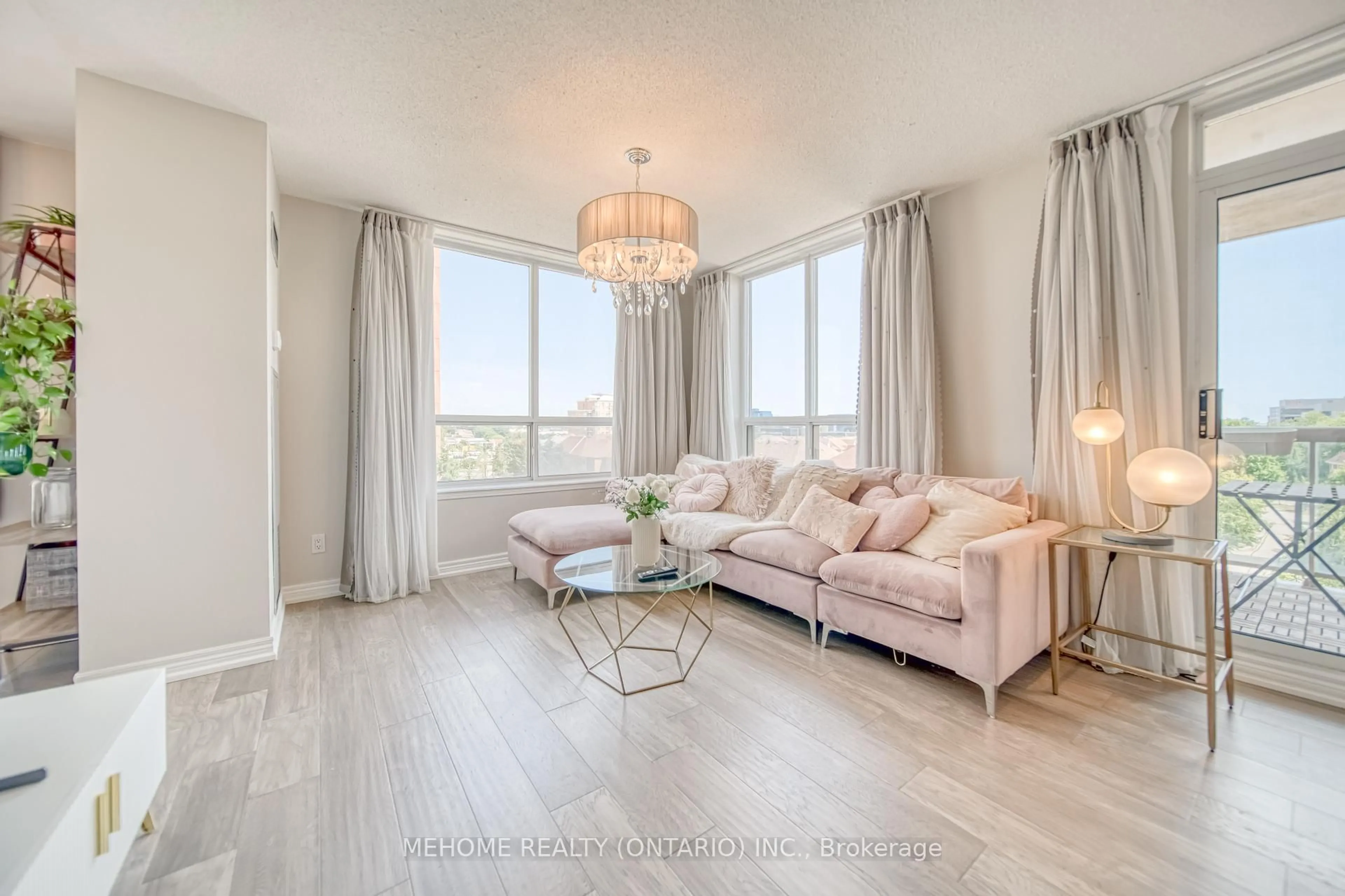 Living room with furniture, wood/laminate floor for 25 Times Ave #610, Markham Ontario L3T 7X5