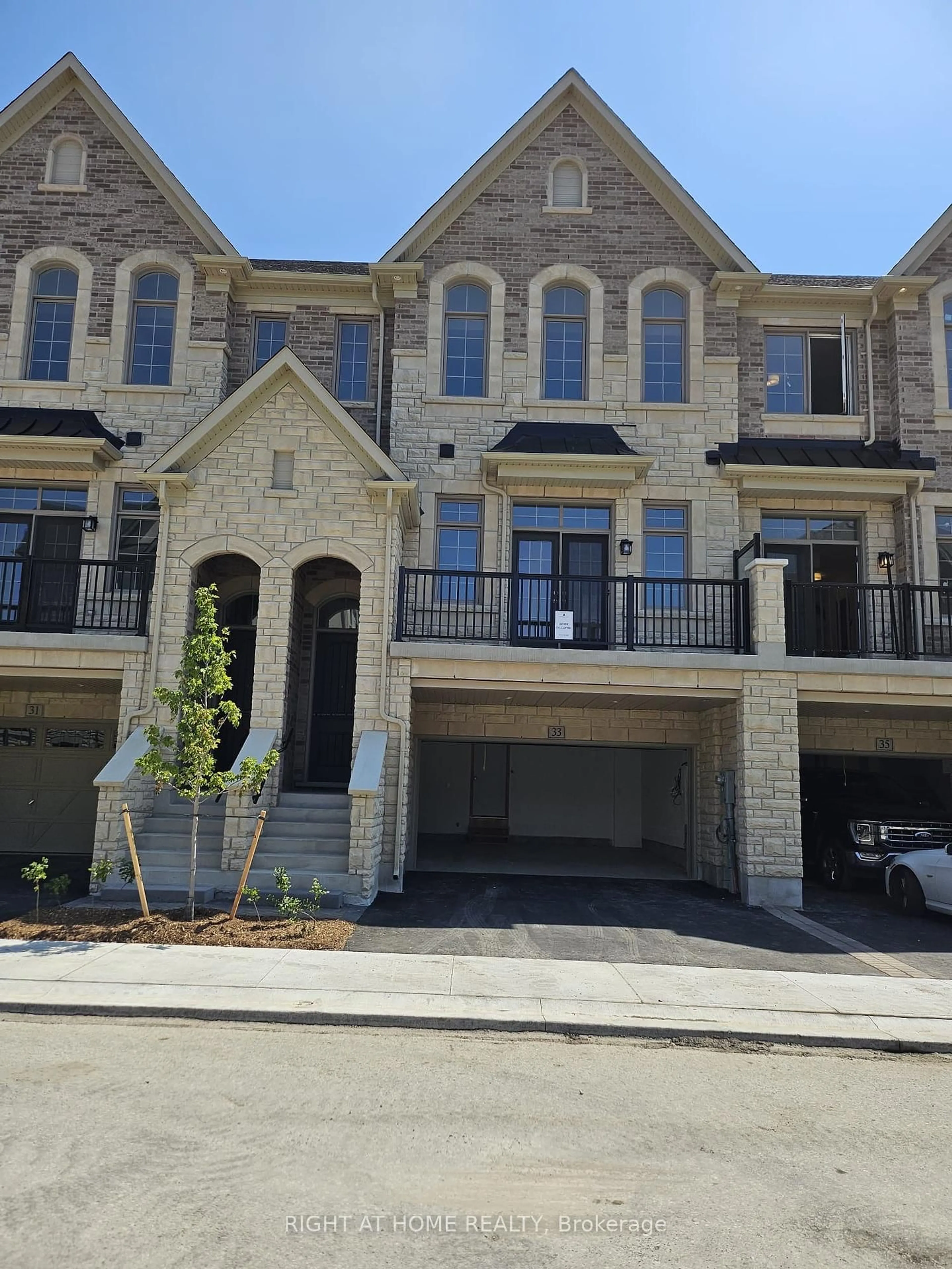 Home with brick exterior material, street for 33 West Village Lane, Markham Ontario L6C 3L5