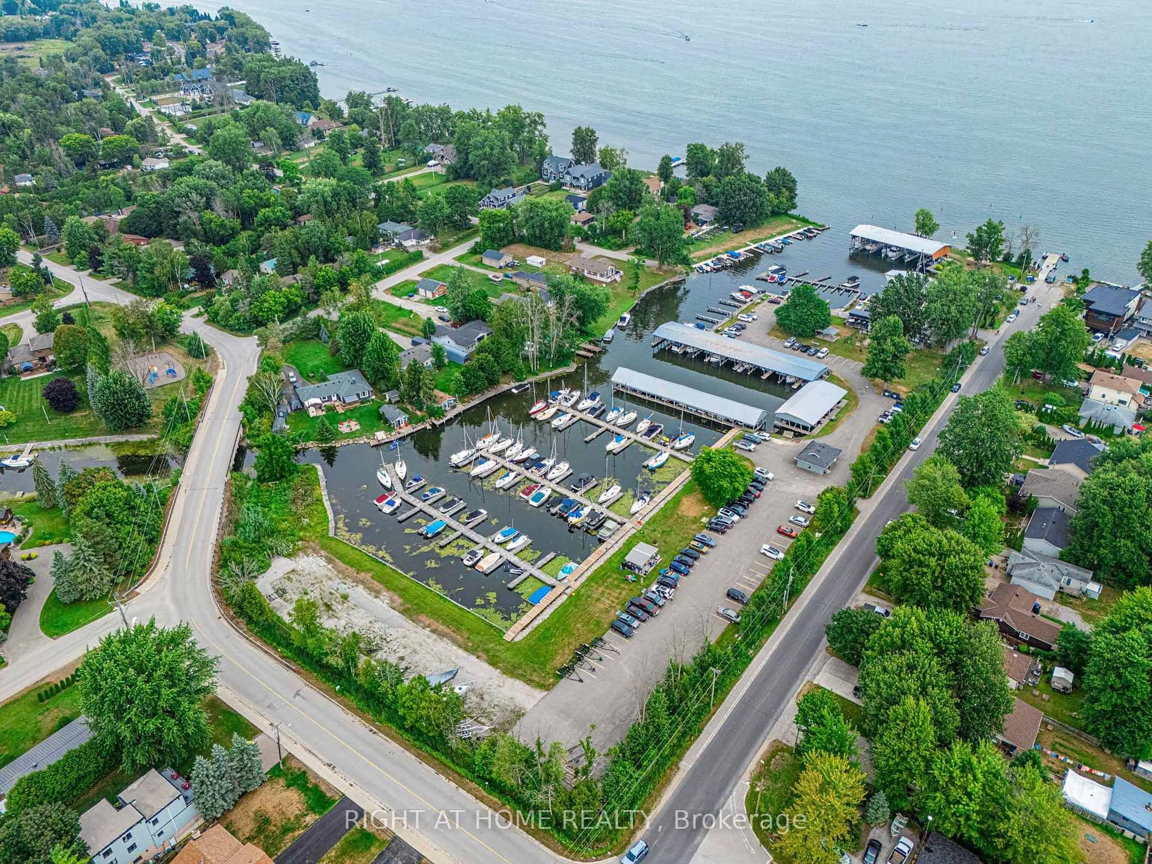 A pic from outside/outdoor area/front of a property/back of a property/a pic from drone, water/lake/river/ocean view for 1129 Lindy Lane, Innisfil Ontario L0L 1R0