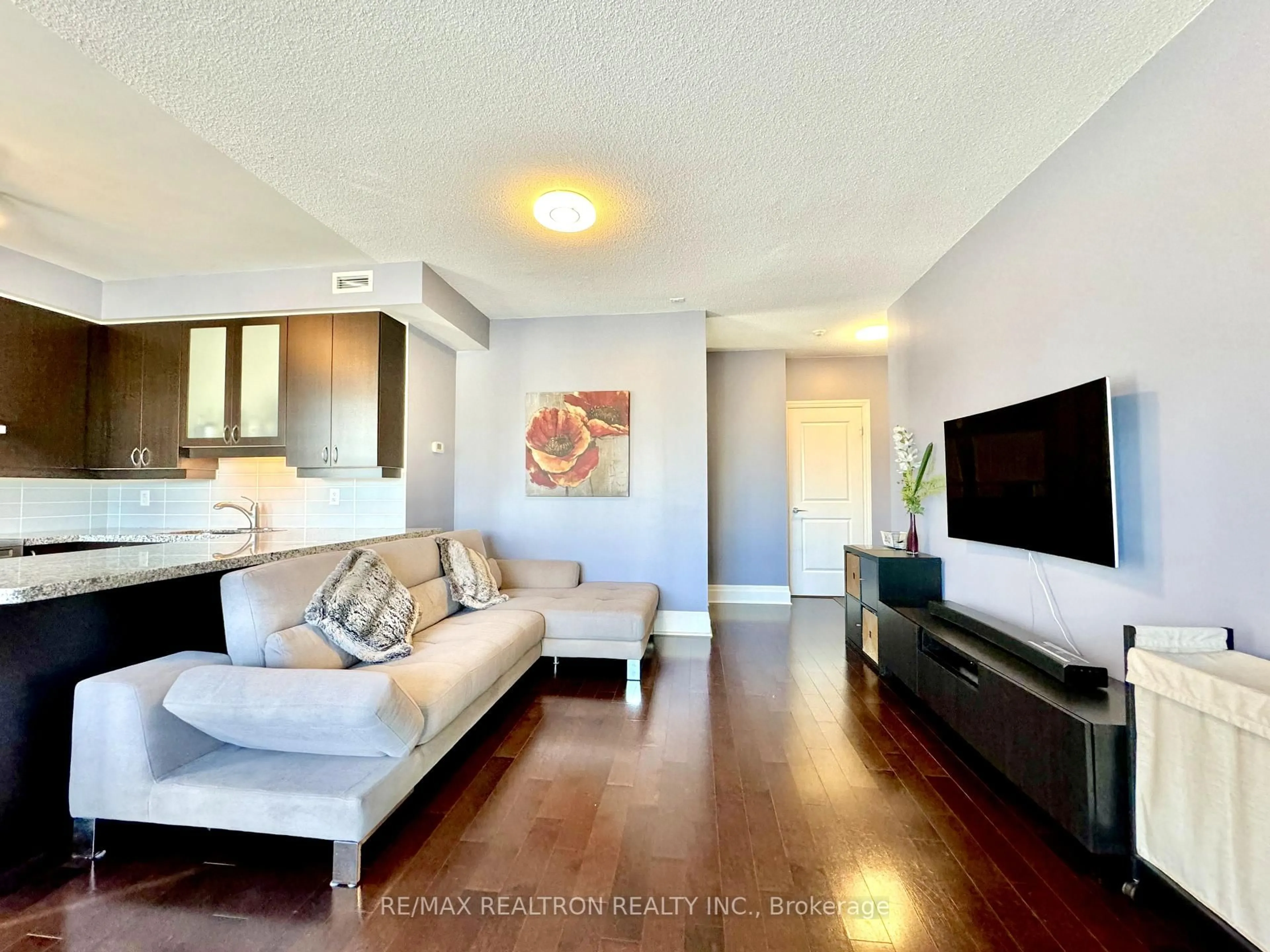 Living room with furniture, wood/laminate floor for 57 Upper Duke Cres #505, Markham Ontario L6G 0B9