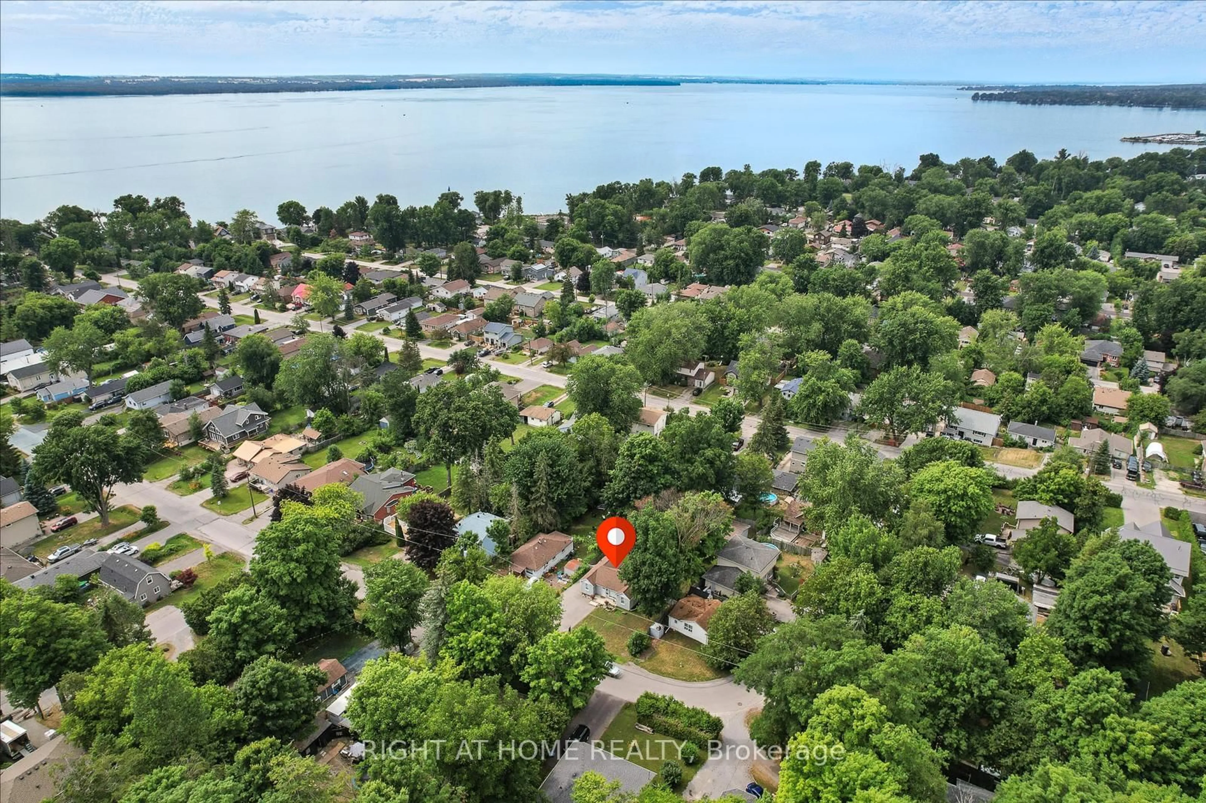 A pic from outside/outdoor area/front of a property/back of a property/a pic from drone, water/lake/river/ocean view for 254 Parkwood Ave, Georgina Ontario L4P 2X3