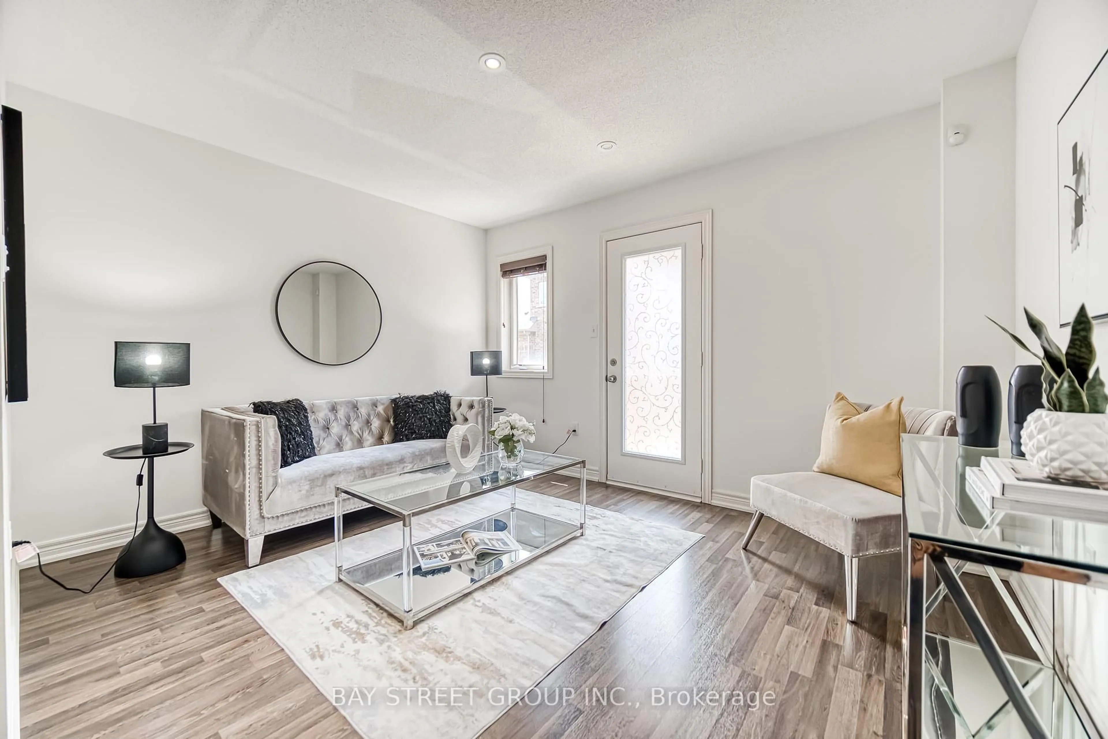 Living room with furniture, wood/laminate floor for 26 Fanny Grove Way, Markham Ontario L6E 0T6