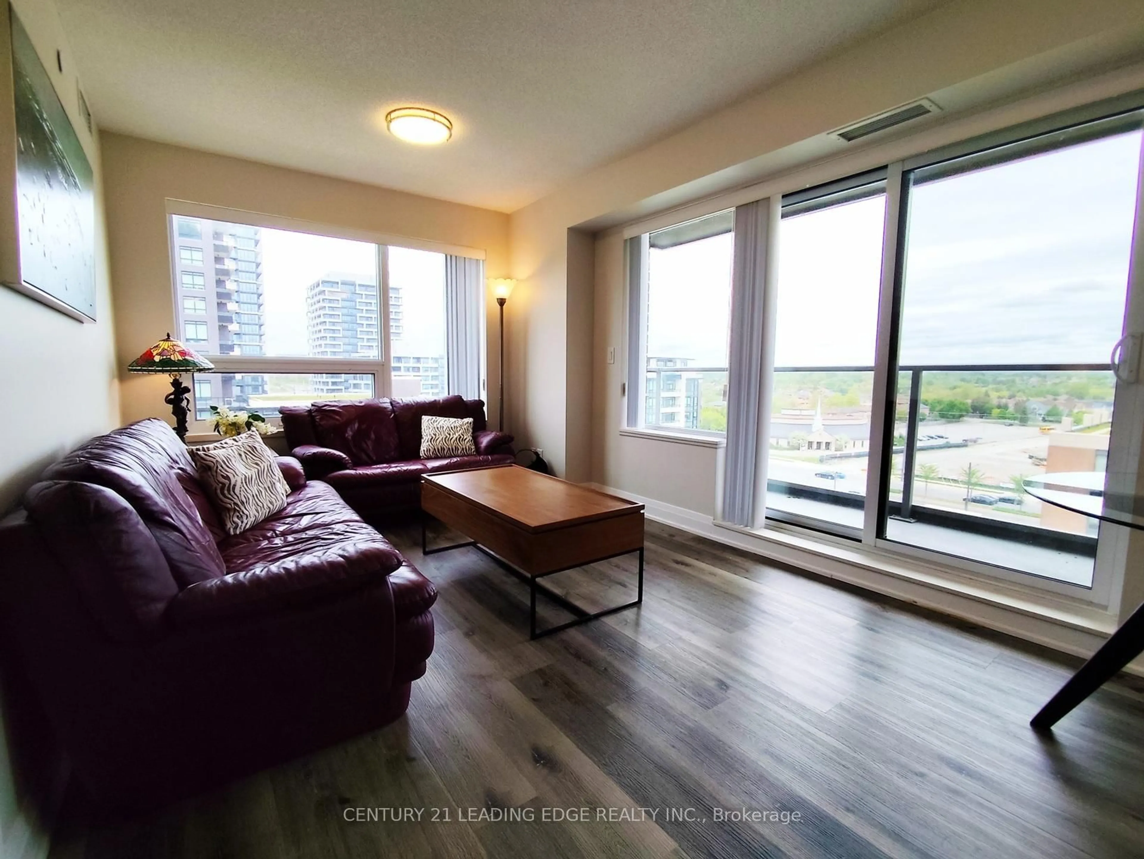 Living room with furniture, wood/laminate floor for 18 Uptown Dr #1010, Markham Ontario L3R 5M5