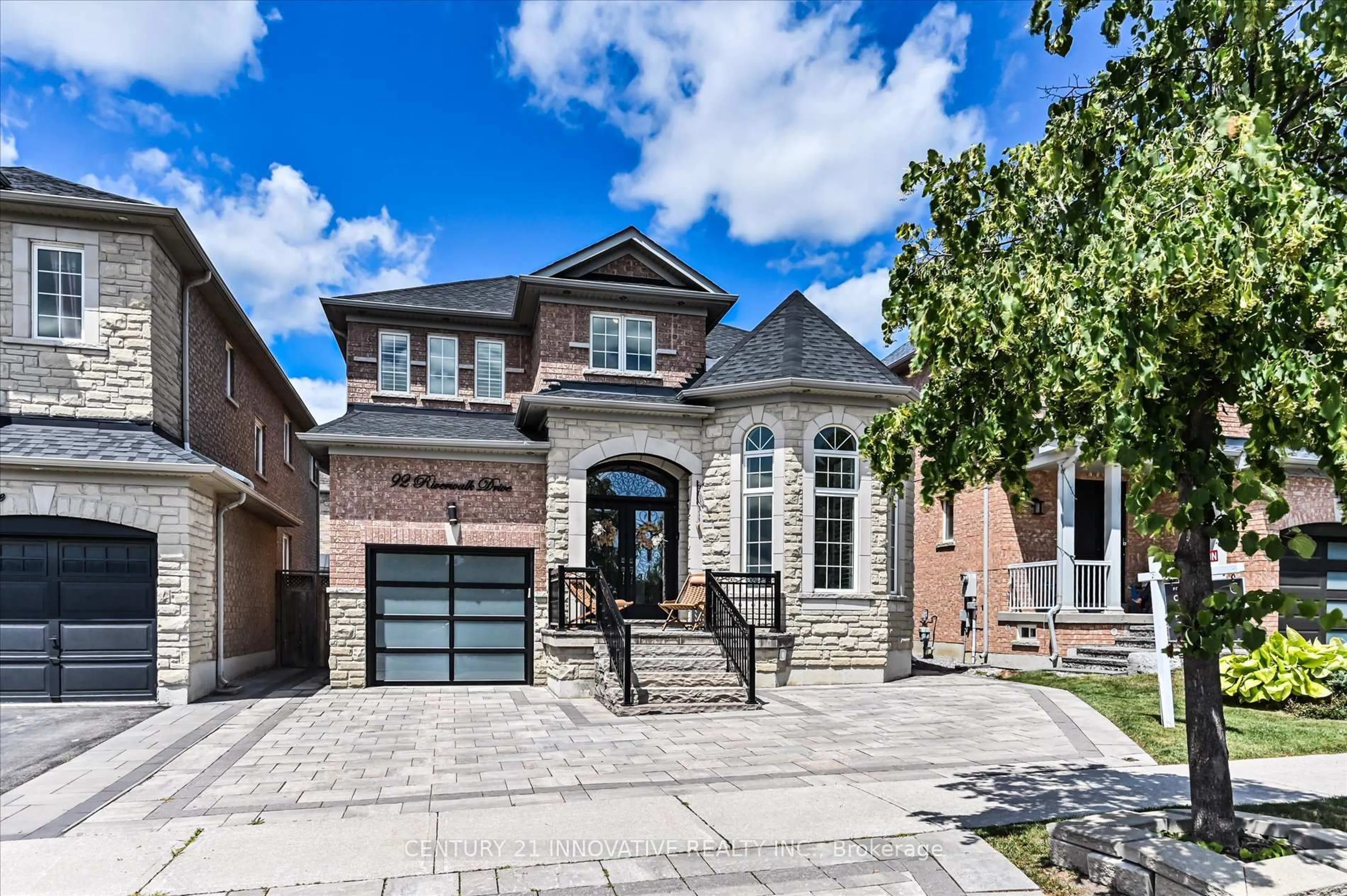 Home with brick exterior material, street for 92 Riverwalk Dr, Markham Ontario L6B 0B9