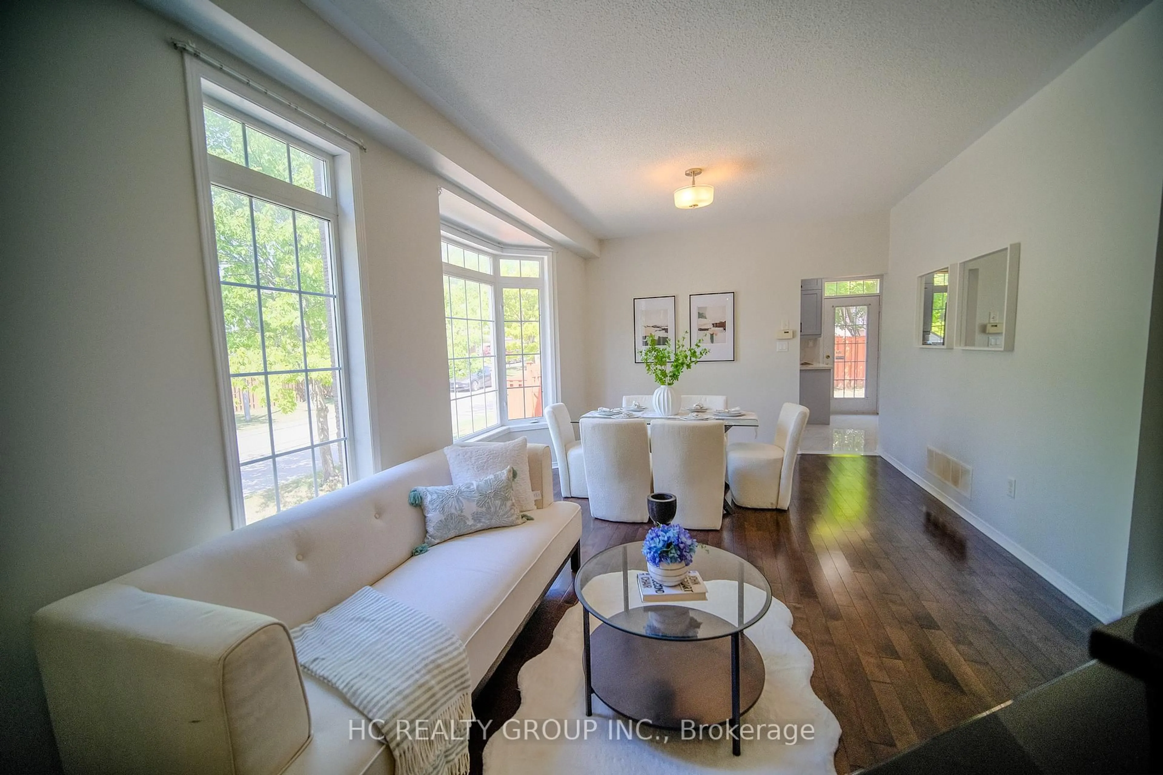 Living room with furniture, wood/laminate floor for 58 Cynthia Jean St, Markham Ontario L6C 2P4