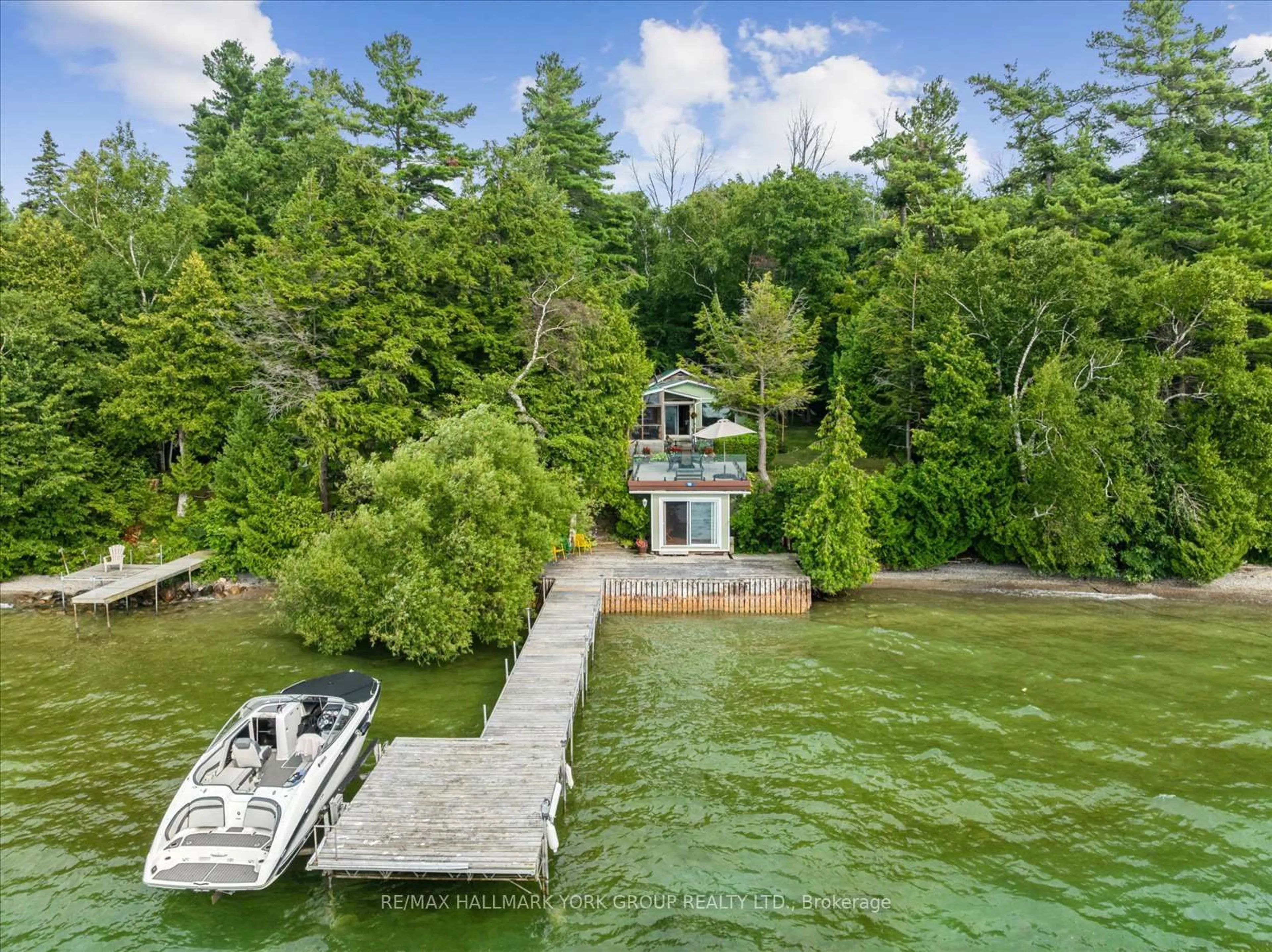 A pic from outside/outdoor area/front of a property/back of a property/a pic from drone, water/lake/river/ocean view for 189 Snake Island Rd, Georgina Islands Ontario L4P 3E9