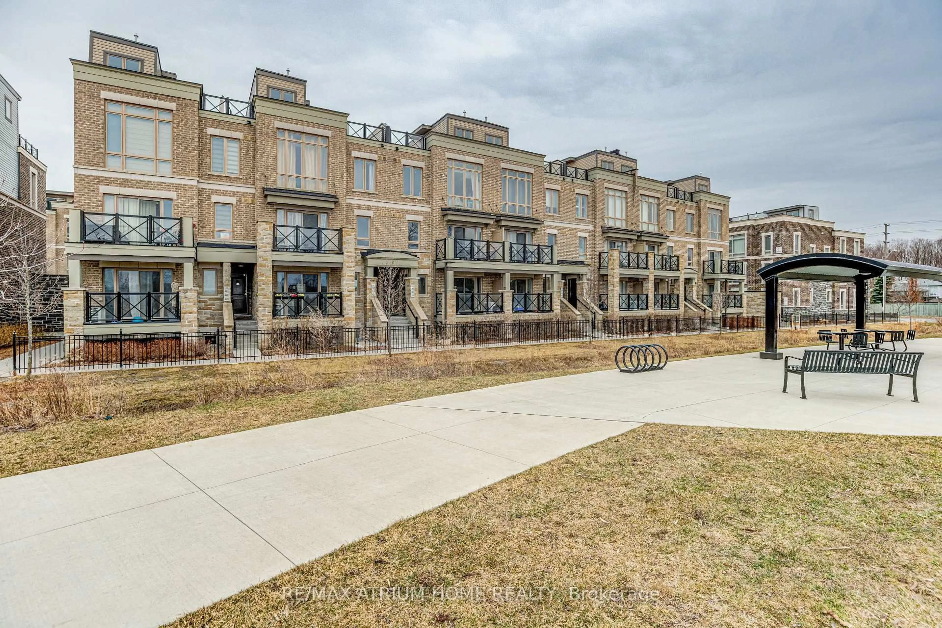 A pic from outside/outdoor area/front of a property/back of a property/a pic from drone, street for 10 Dunsheath Way #220, Markham Ontario L6B 1N3