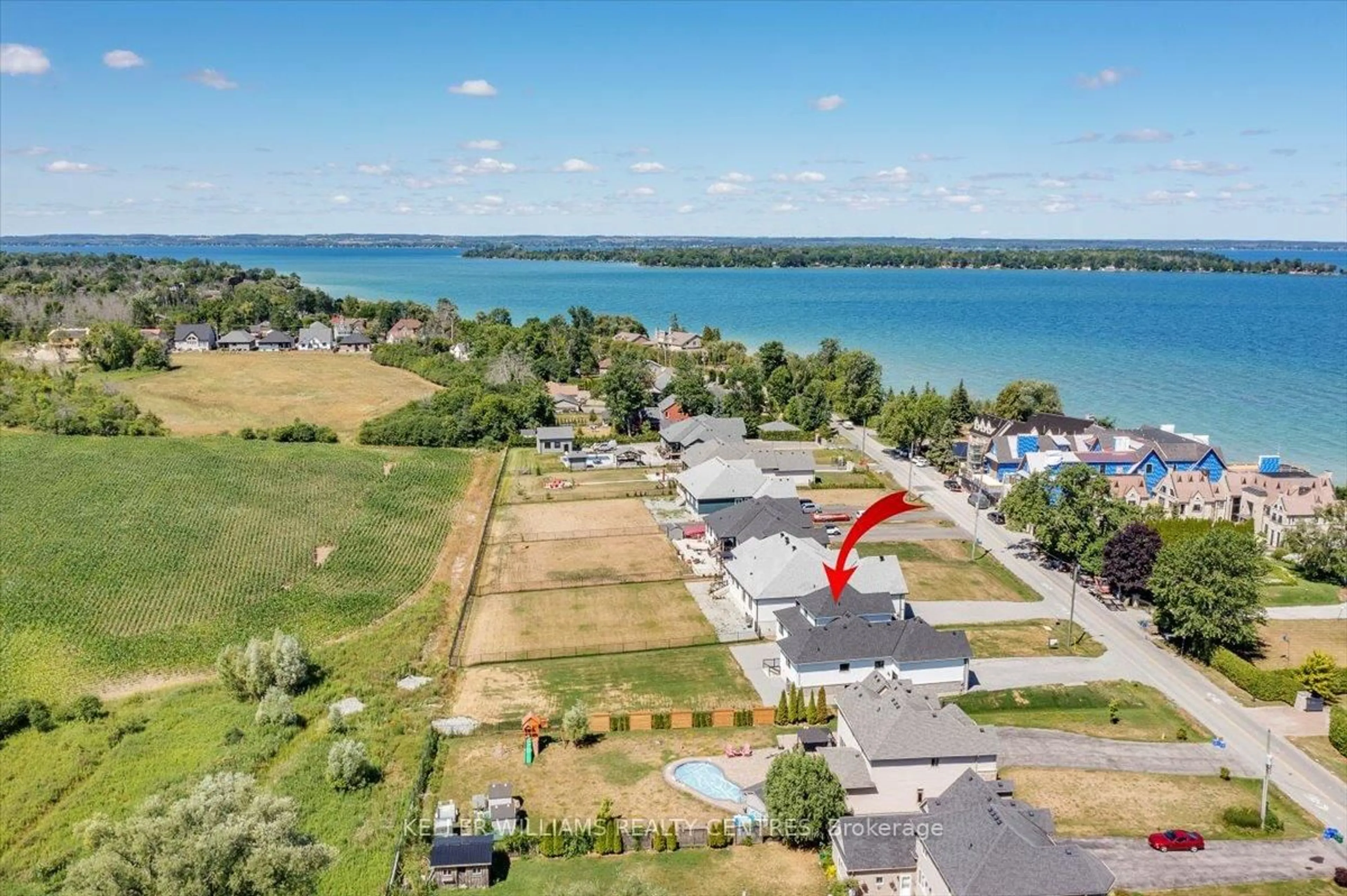 A pic from outside/outdoor area/front of a property/back of a property/a pic from drone, water/lake/river/ocean view for 147 Lake Dr, Georgina Ontario L4P 0S7