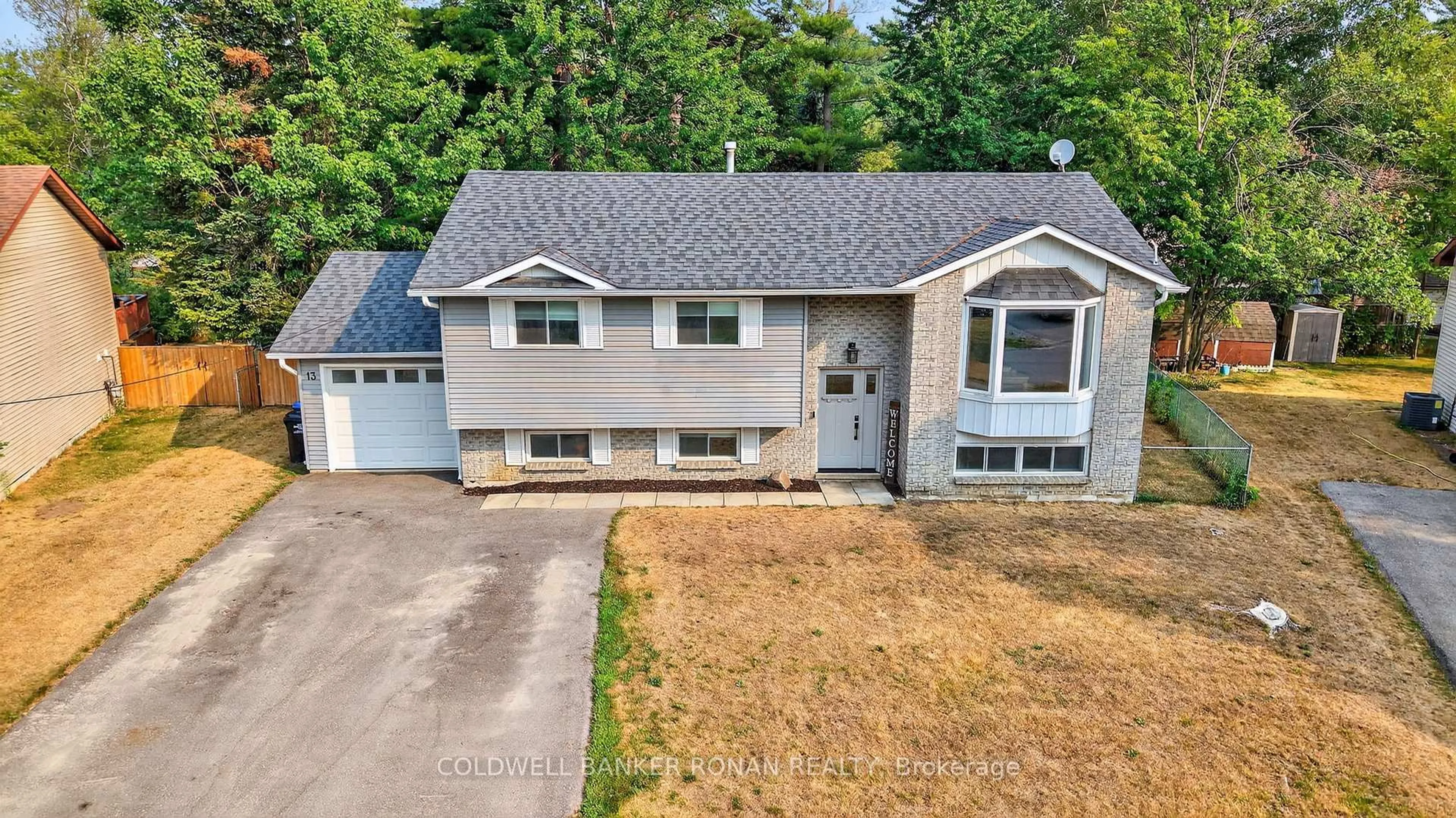 A pic from outside/outdoor area/front of a property/back of a property/a pic from drone, street for 13 Pridham Cres, Essa Ontario L3W 0G5