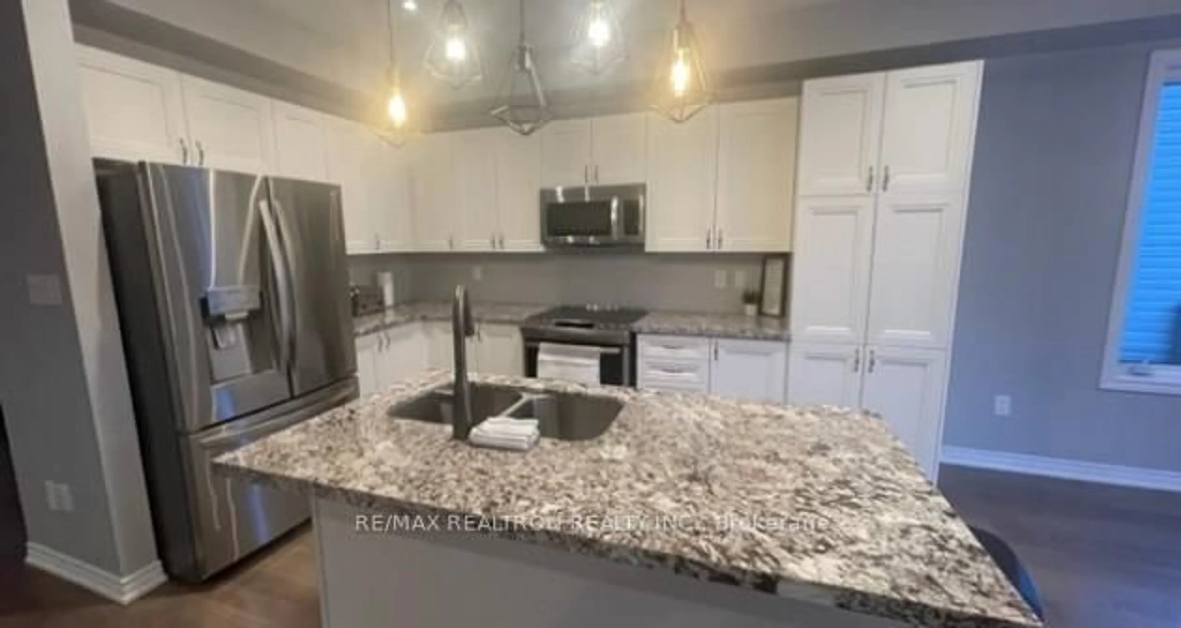 Open concept kitchen, ceramic/tile floor for 67 Greenwood Dr, Essa Ontario L0M 1B5