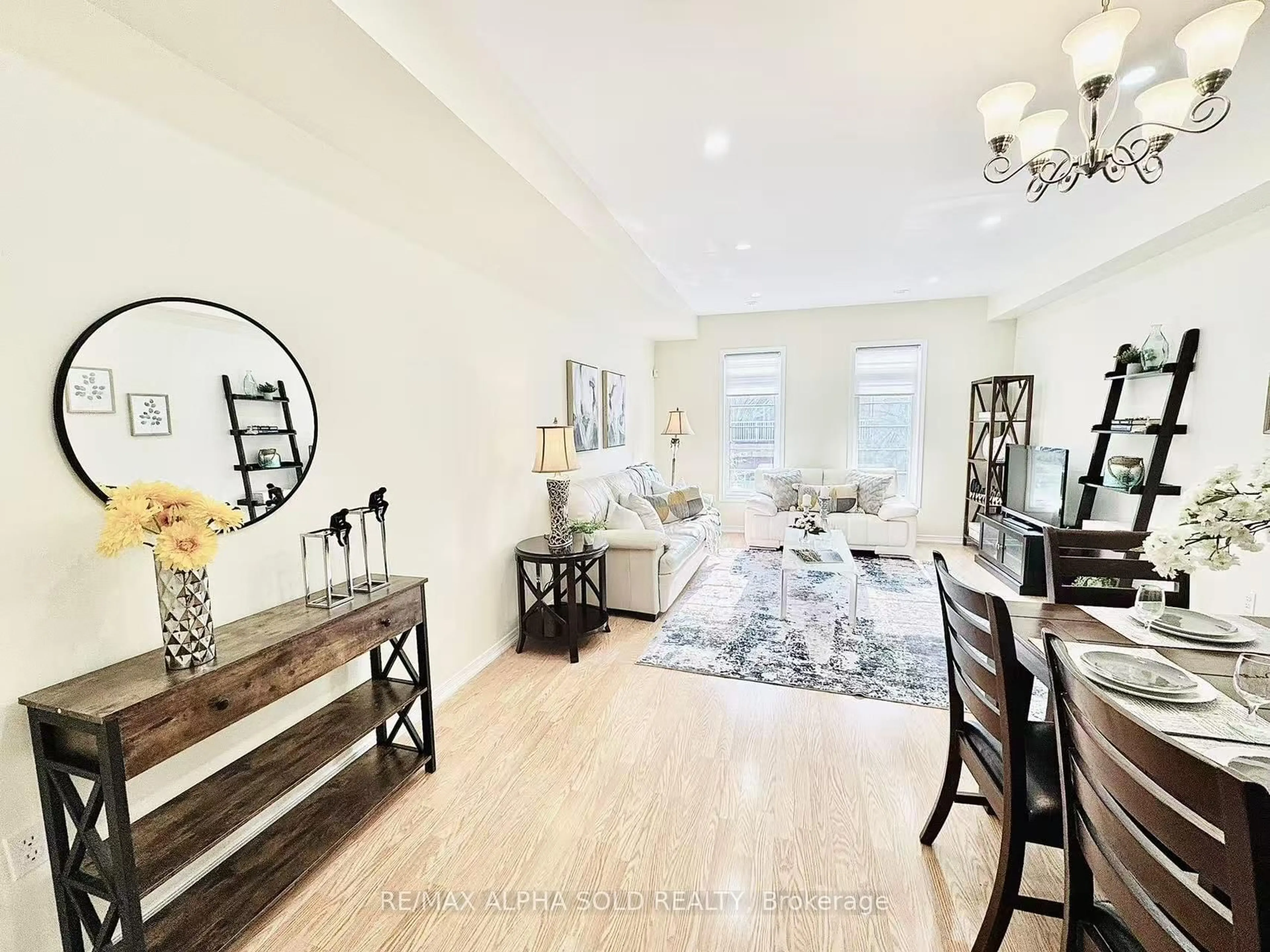 Living room with furniture, wood/laminate floor for 43 Beehive Lane, Markham Ontario L6E 0K6