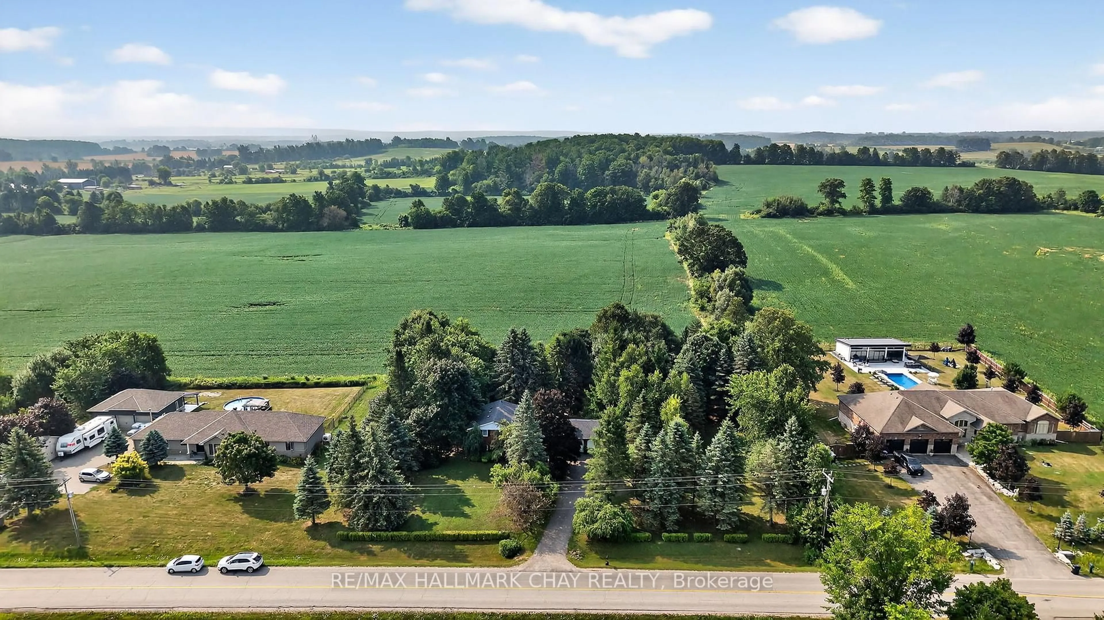 A pic from outside/outdoor area/front of a property/back of a property/a pic from drone, forest/trees view for 5205 5th Line, New Tecumseth Ontario L0G 1W0