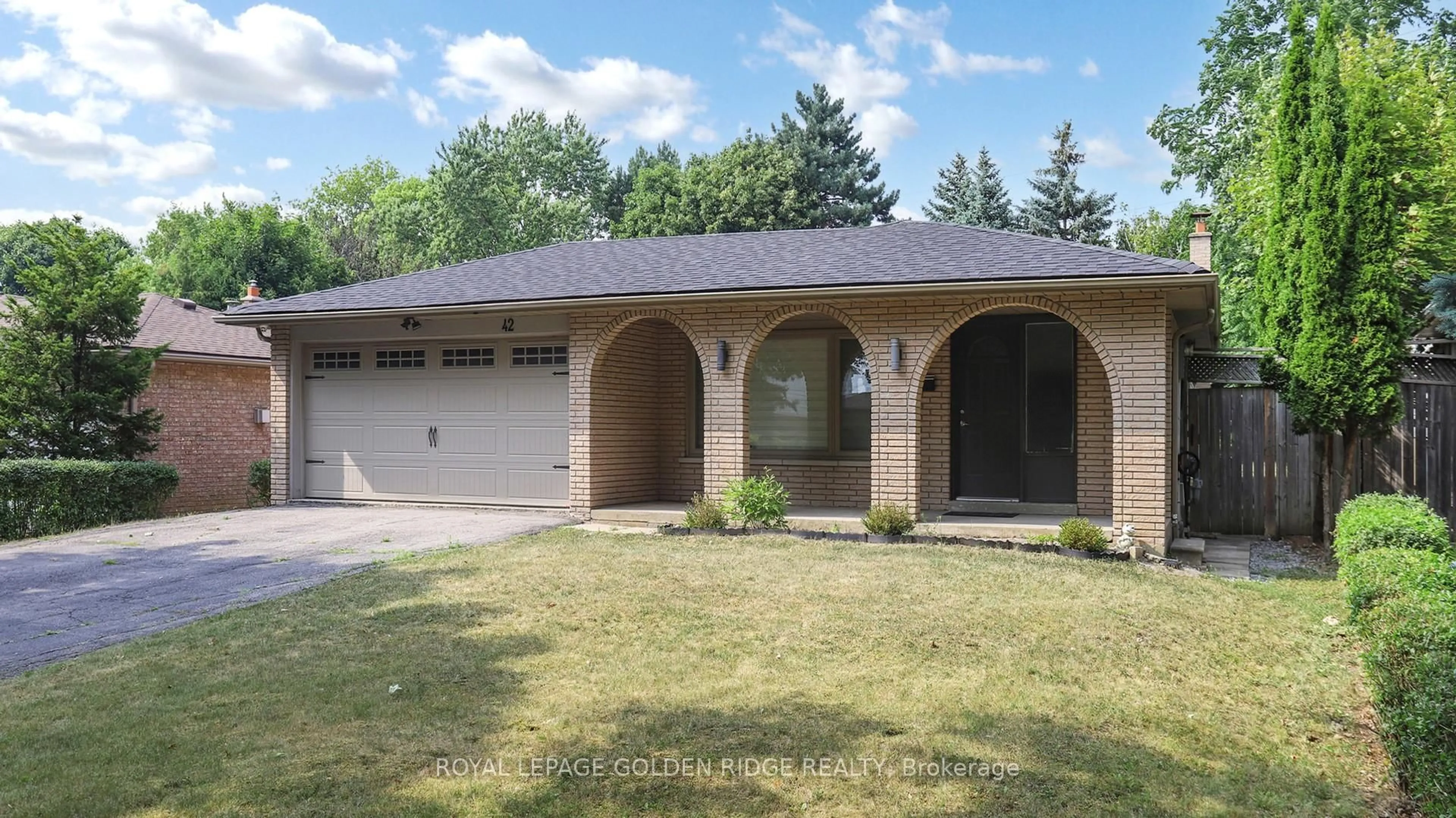 Home with brick exterior material, street for 42 Castle Harbour Lane, Markham Ontario L3T 3A2