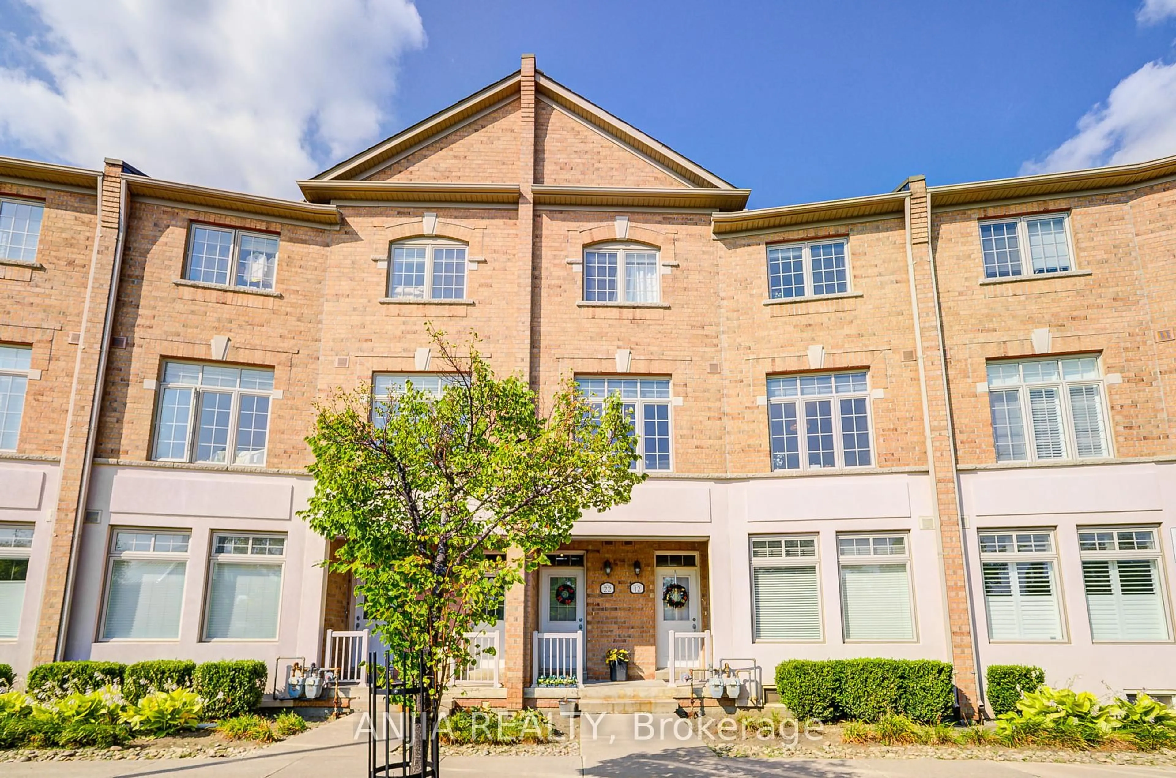 Home with brick exterior material, building for 30 Greensborough Village Circ #22, Markham Ontario L6E 1Z1
