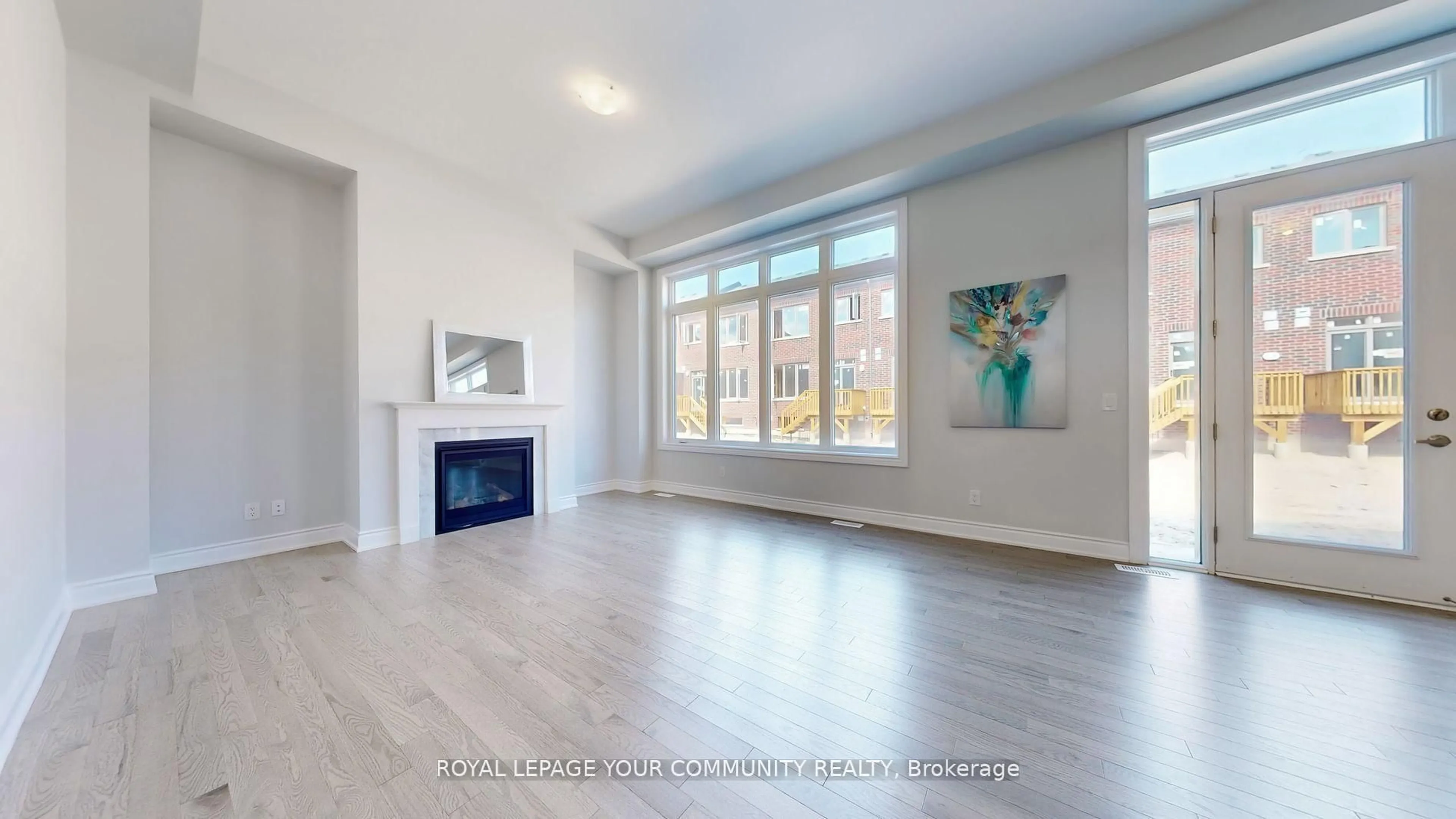 Living room with furniture, wood/laminate floor for 158 Harvey Bunker Cres, Markham Ontario L6C 3M8