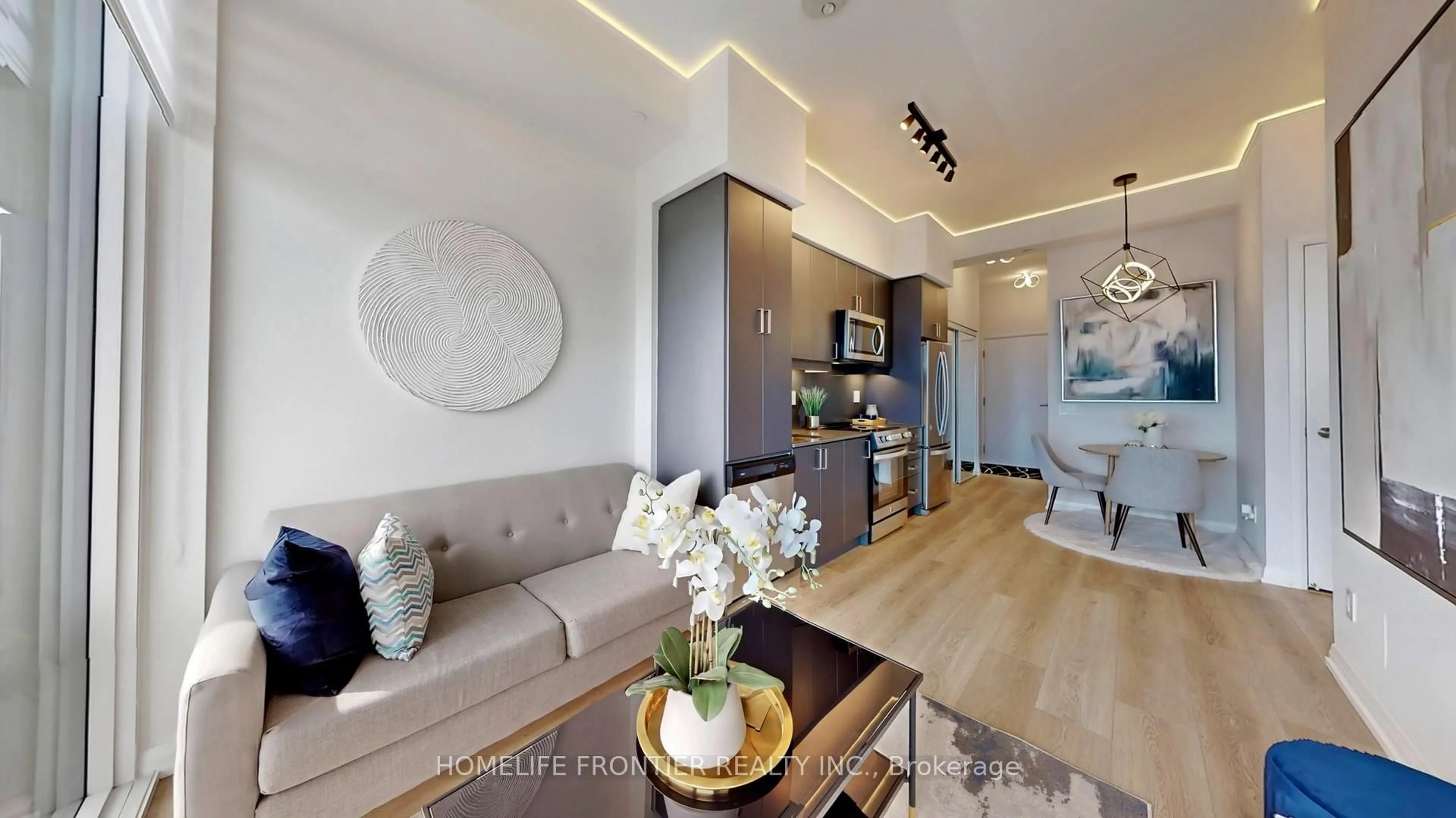 Living room with furniture, wood/laminate floor for 7895 Jane St #1001, Vaughan Ontario M3B 2M3
