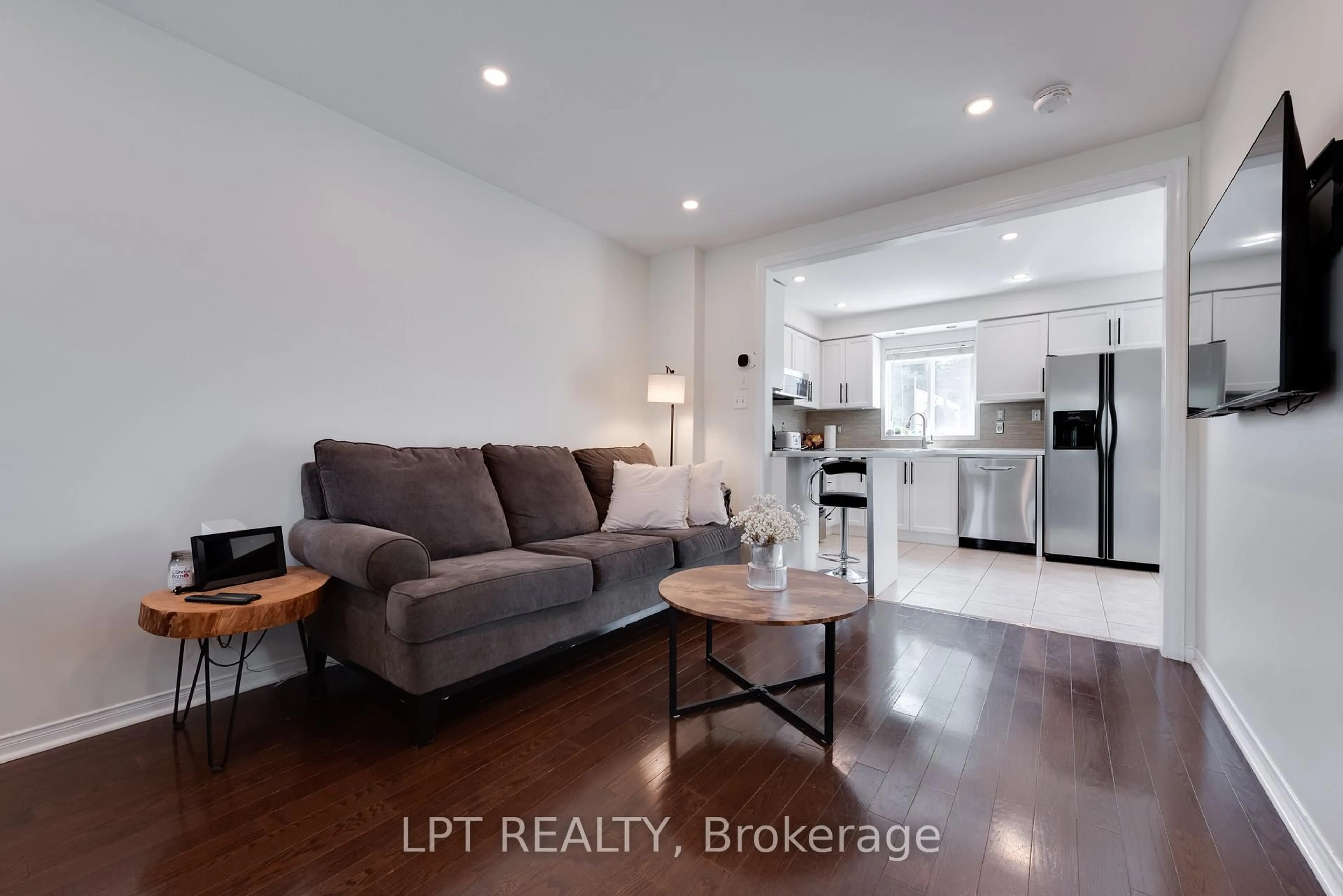 Living room with furniture, wood/laminate floor for 11 Lookout St, Essa Ontario L0M 1B4