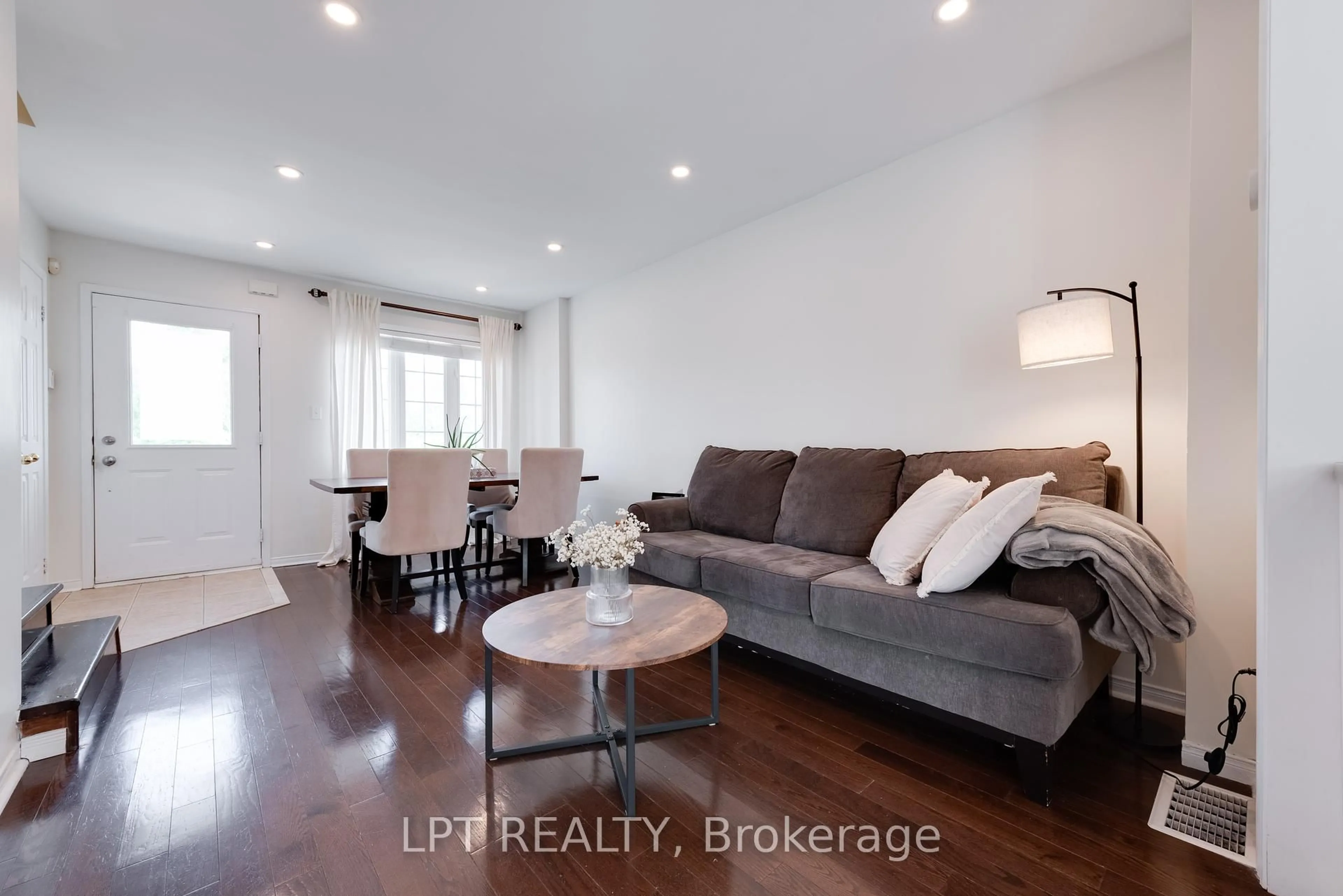 Living room with furniture, wood/laminate floor for 11 Lookout St, Essa Ontario L0M 1B4