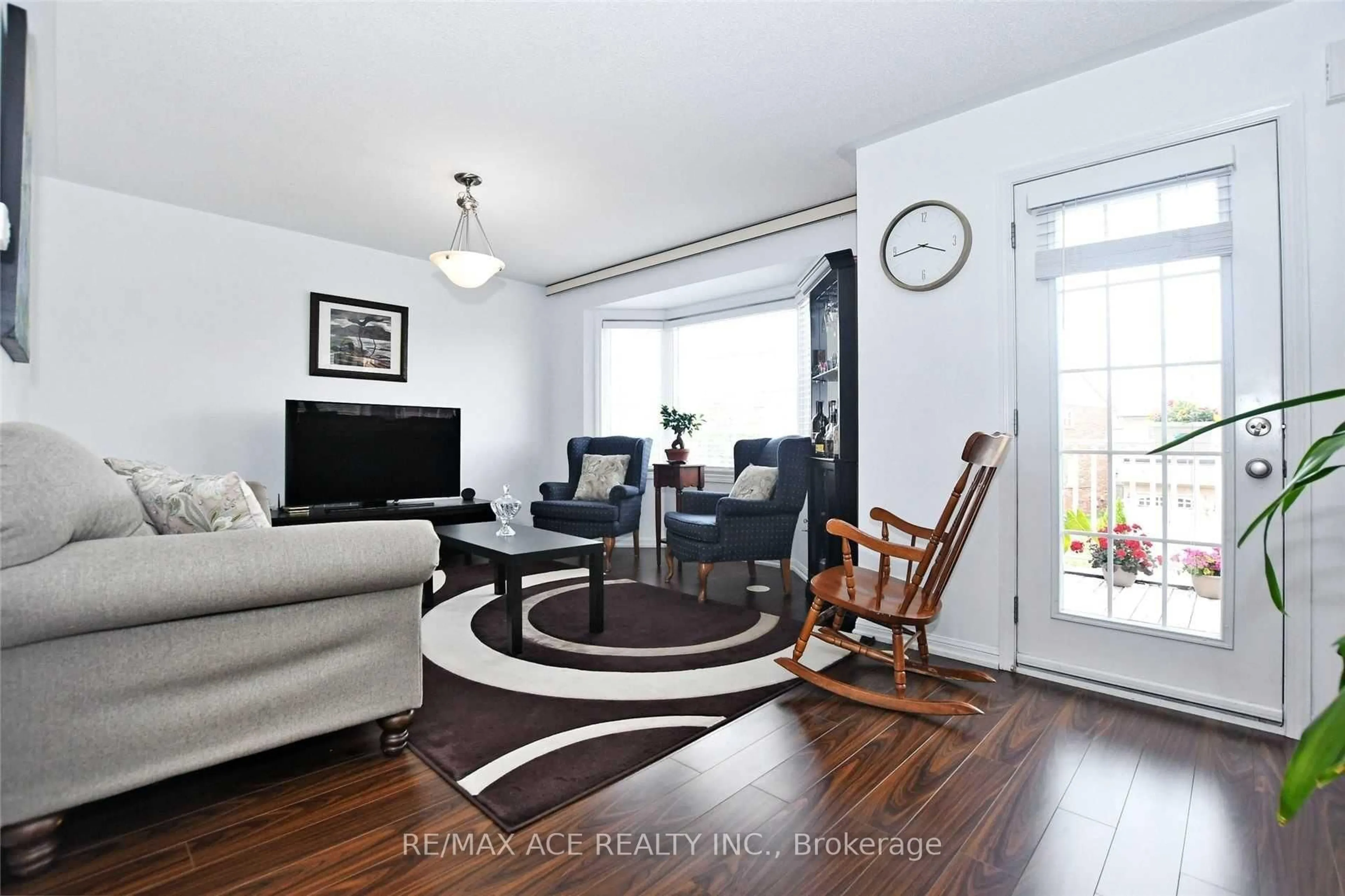 Living room with furniture, wood/laminate floor for 52 Cliff Gunn Rd, Newmarket Ontario L3X 3J7