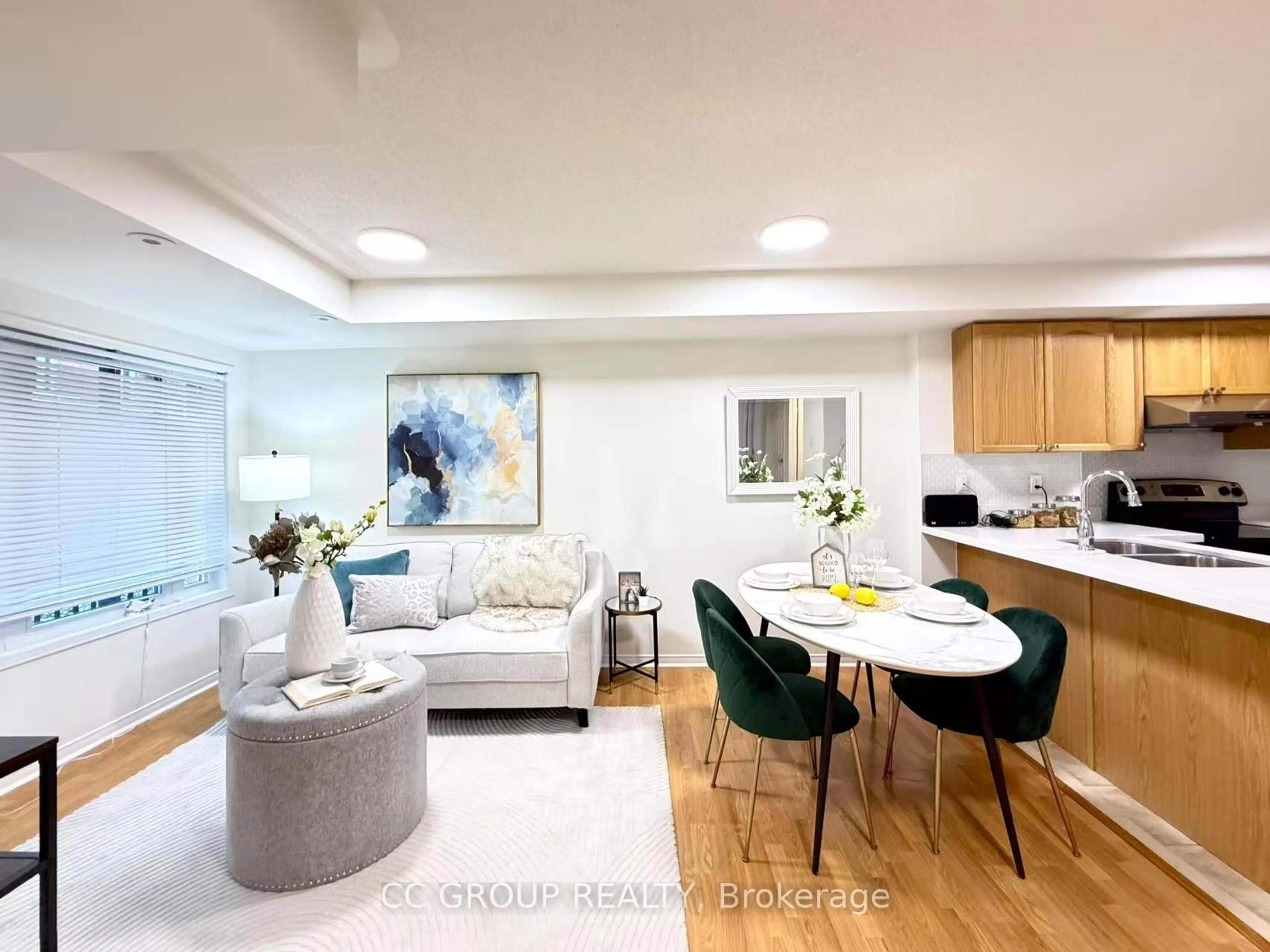 Living room with furniture, wood/laminate floor for 312 John St #359, Markham Ontario L3T 0A7