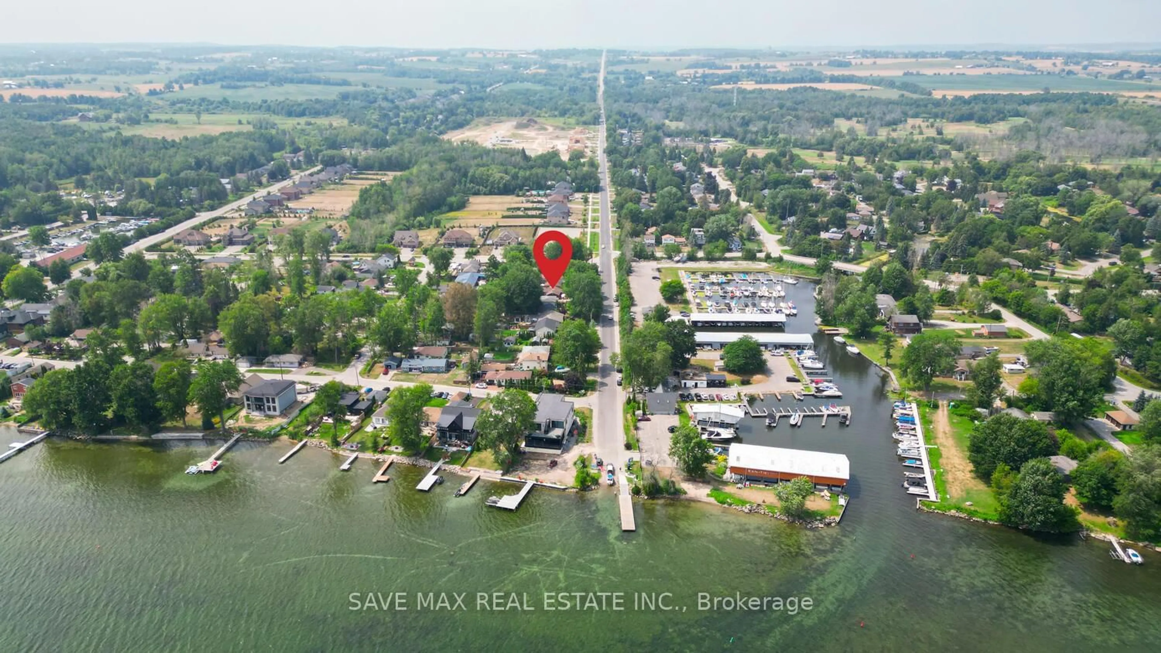 A pic from outside/outdoor area/front of a property/back of a property/a pic from drone, water/lake/river/ocean view for 1127 Shore Acres Dr, Innisfil Ontario L0L 1R0