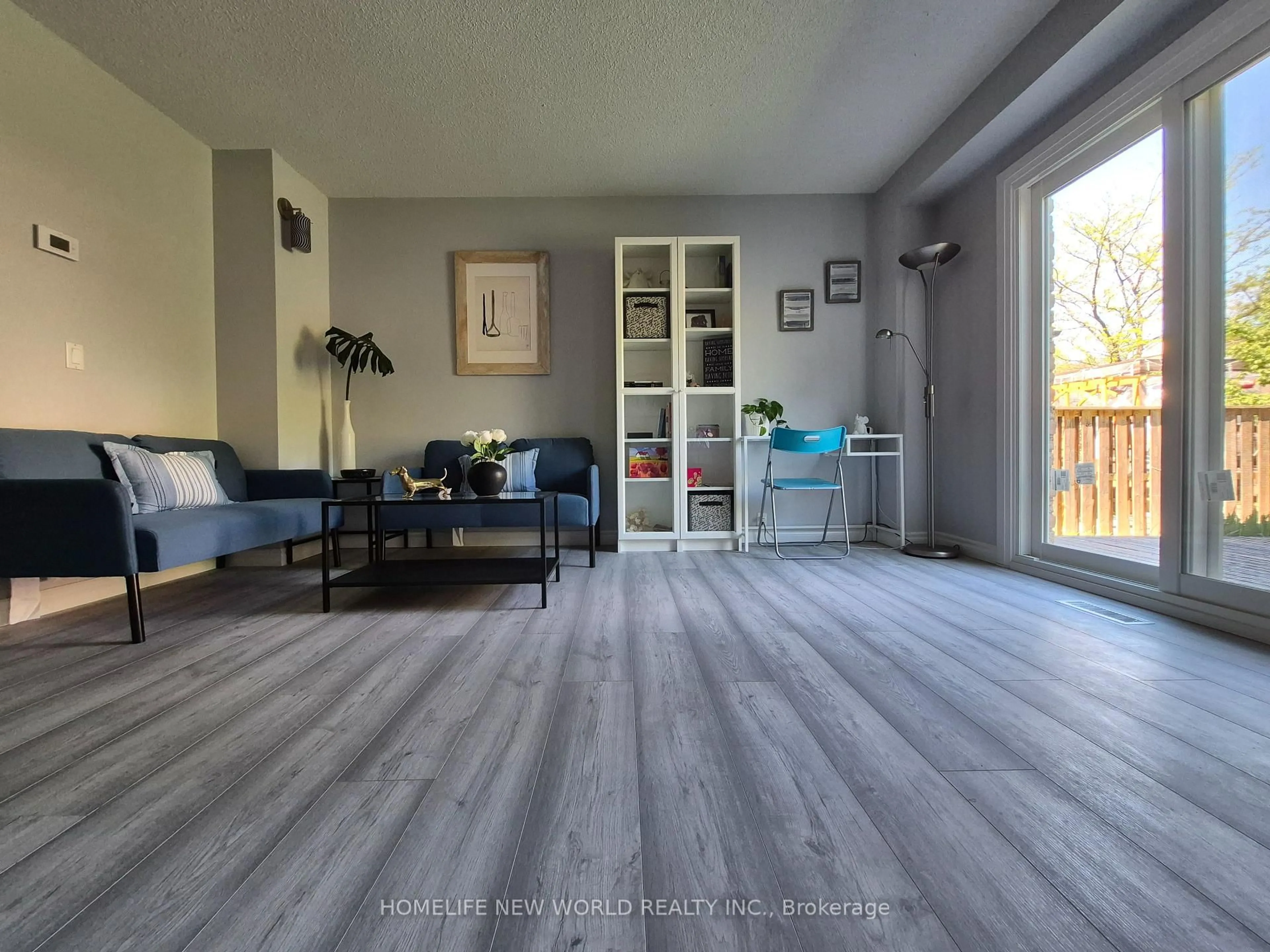 Living room with furniture, wood/laminate floor for 88 Madsen Cres, Markham Ontario L3R 4P3